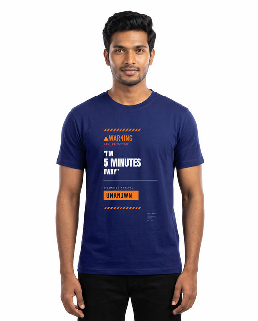 Male model wearing 5 MINS AWAY men's regular-fit t-shirt in royal blue in a studio setting.