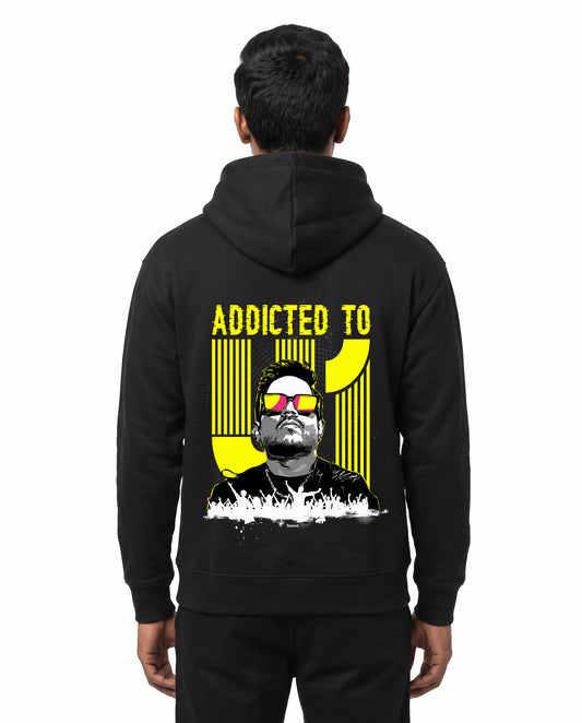Back view of male model wearing ADDICTED TO U1 unisex regular-fit hoodie in black in a studio setting.