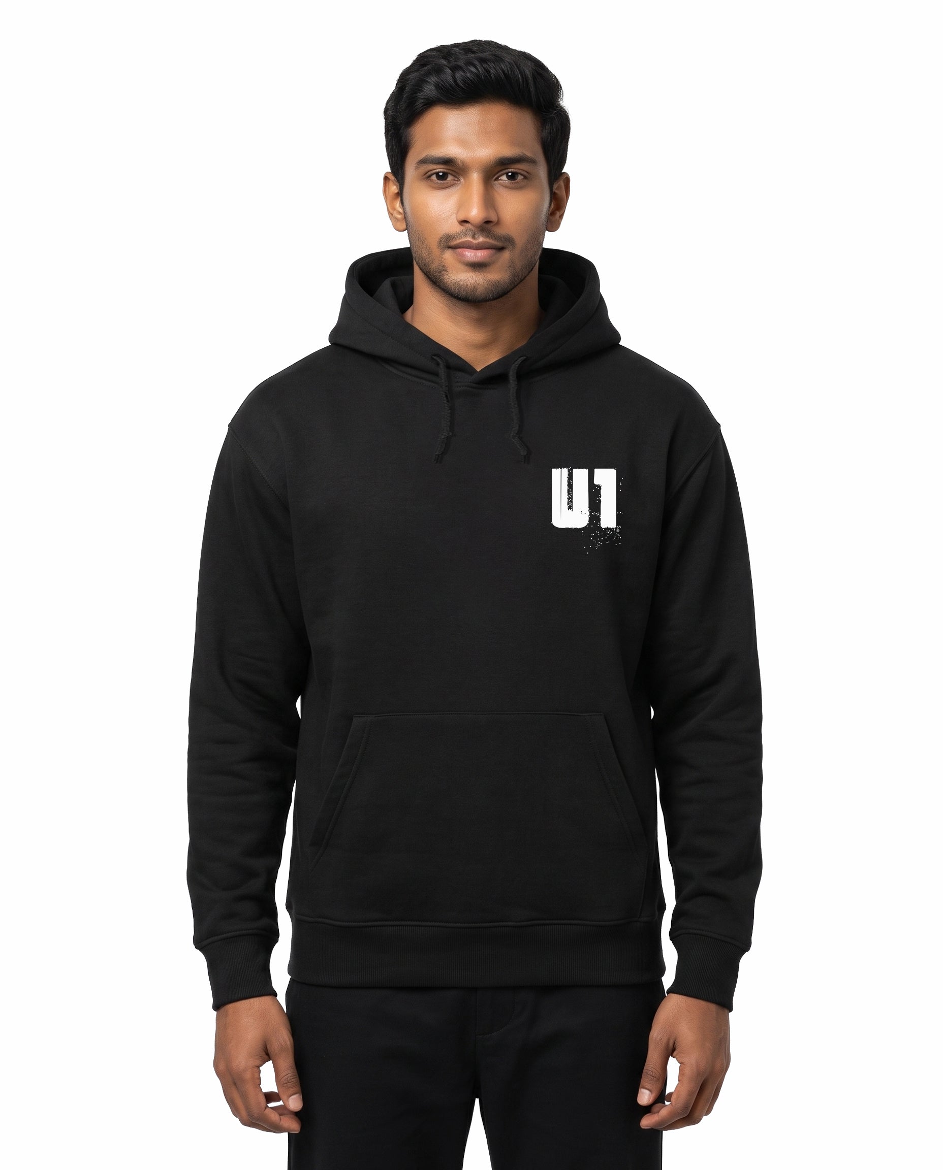 Front view of male model wearing ADDICTED TO U1 unisex regular-fit hoodie in black in a studio setting.