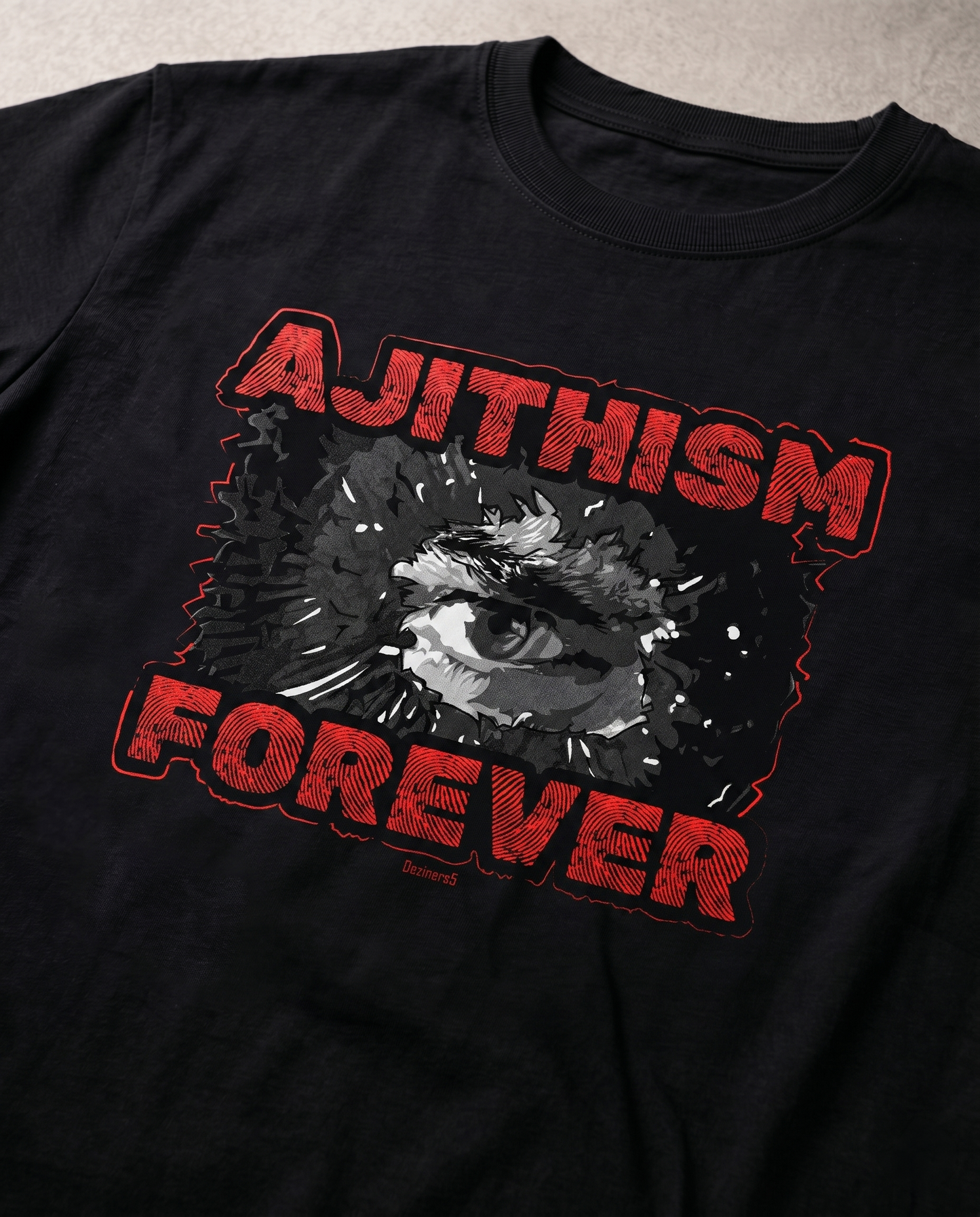Detailed close-up of the AJITHISM FOREVER graphic print showcasing premium print quality on a black men's regular-fit t-shirt.