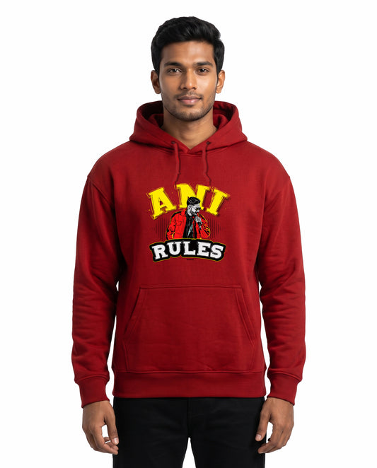 Front view of male model wearing ANI RULES - Unisex Regular Fit Hoodie in red in a studio setting.