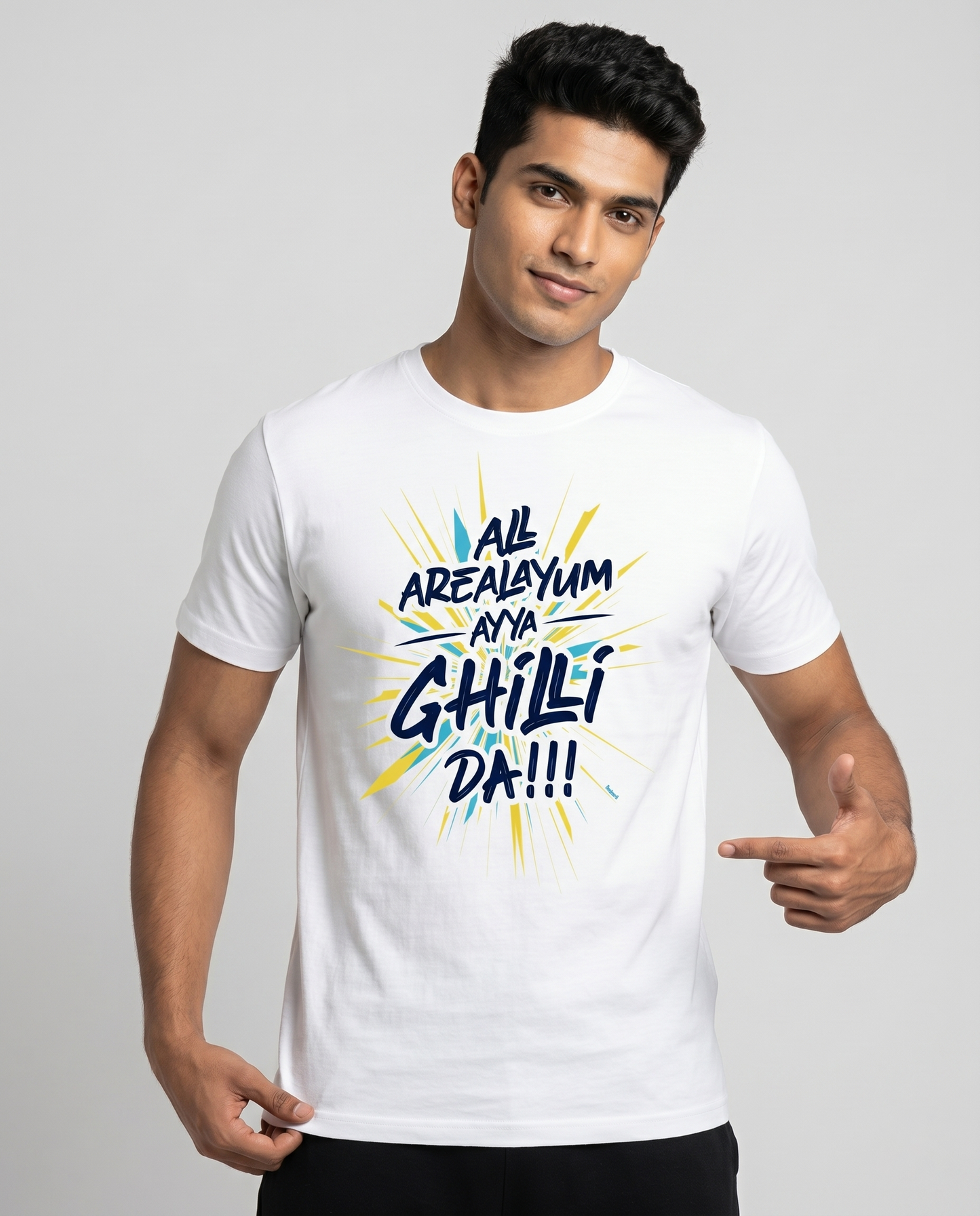 Young South Indian male wearing AREA GHILLI Vijay fan inspired regular fit t-shirt in white in premium studio fashion portrait.