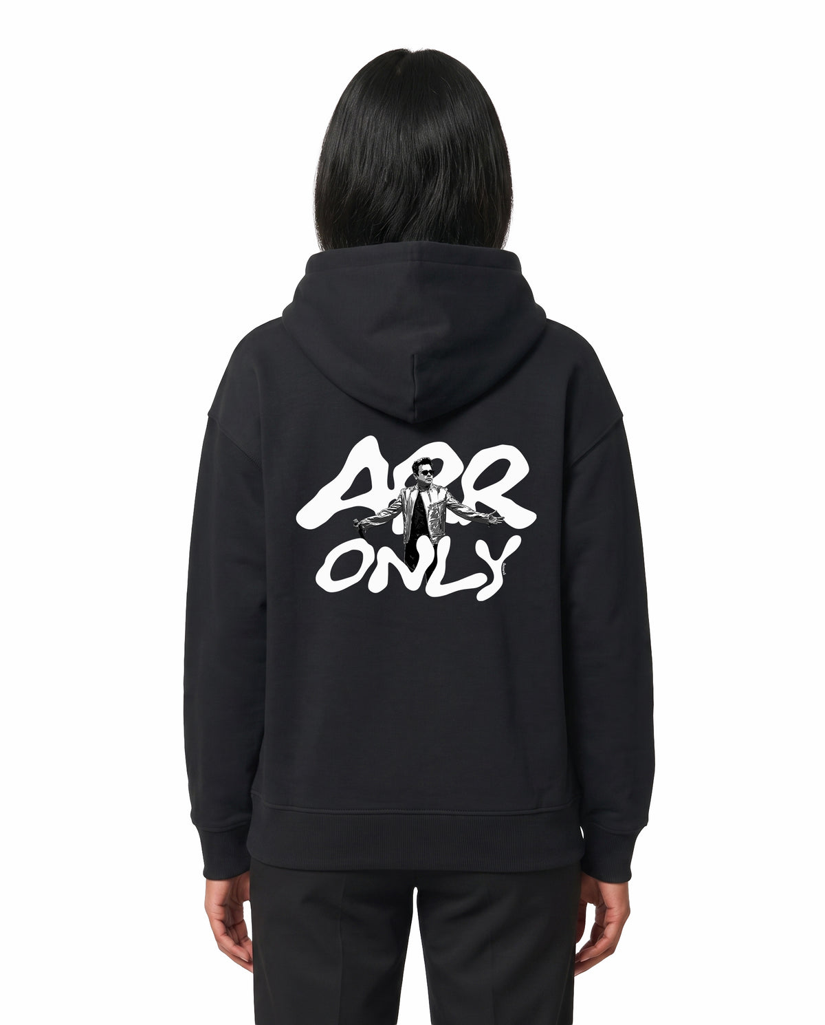 Back view of female model wearing ARR TRIBUTE - Unisex Regular Fit Hoodie in black in a studio setting.