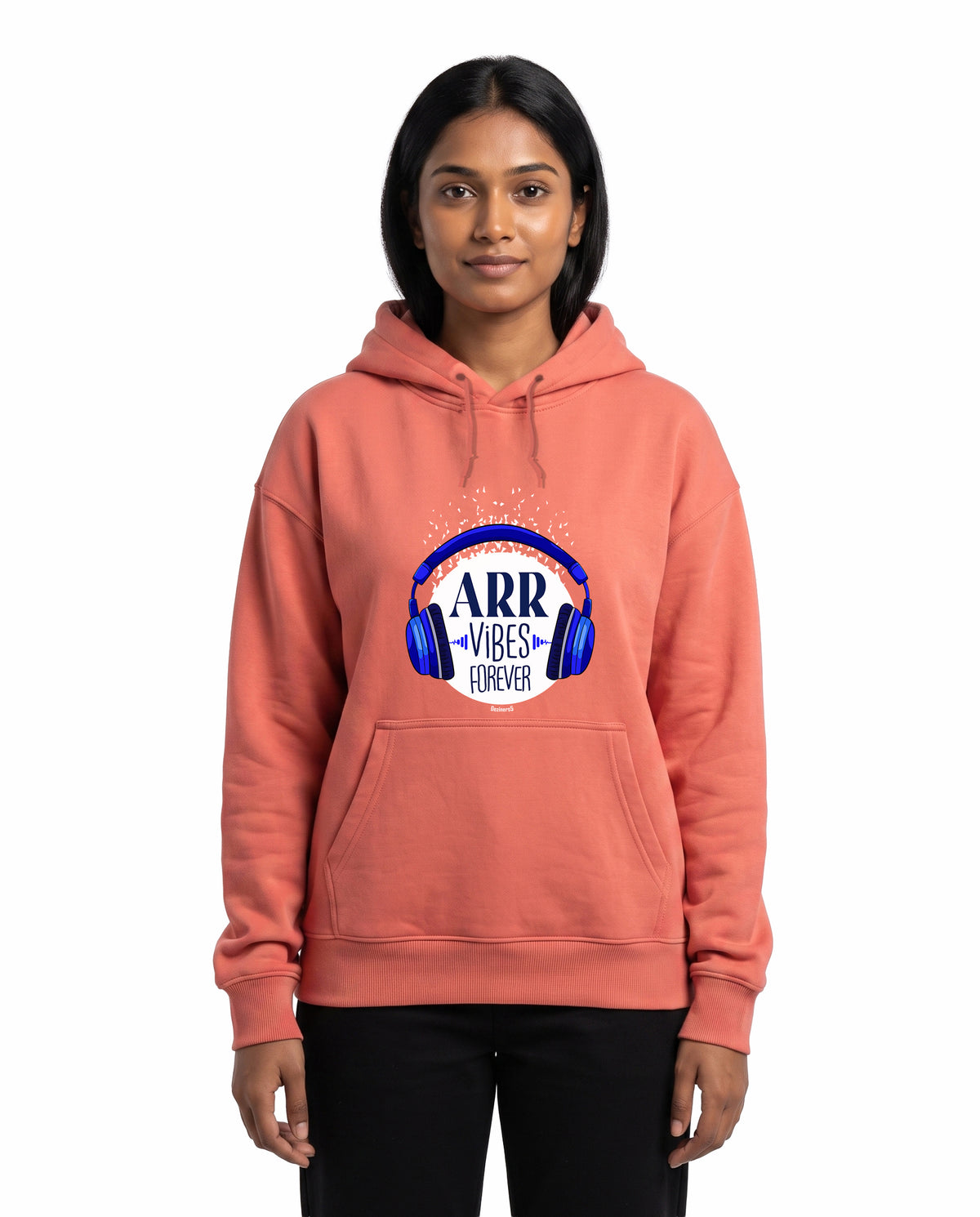 Front view of female model wearing ARR VIBES - Unisex Regular Fit Hoodie in coral in a studio setting.