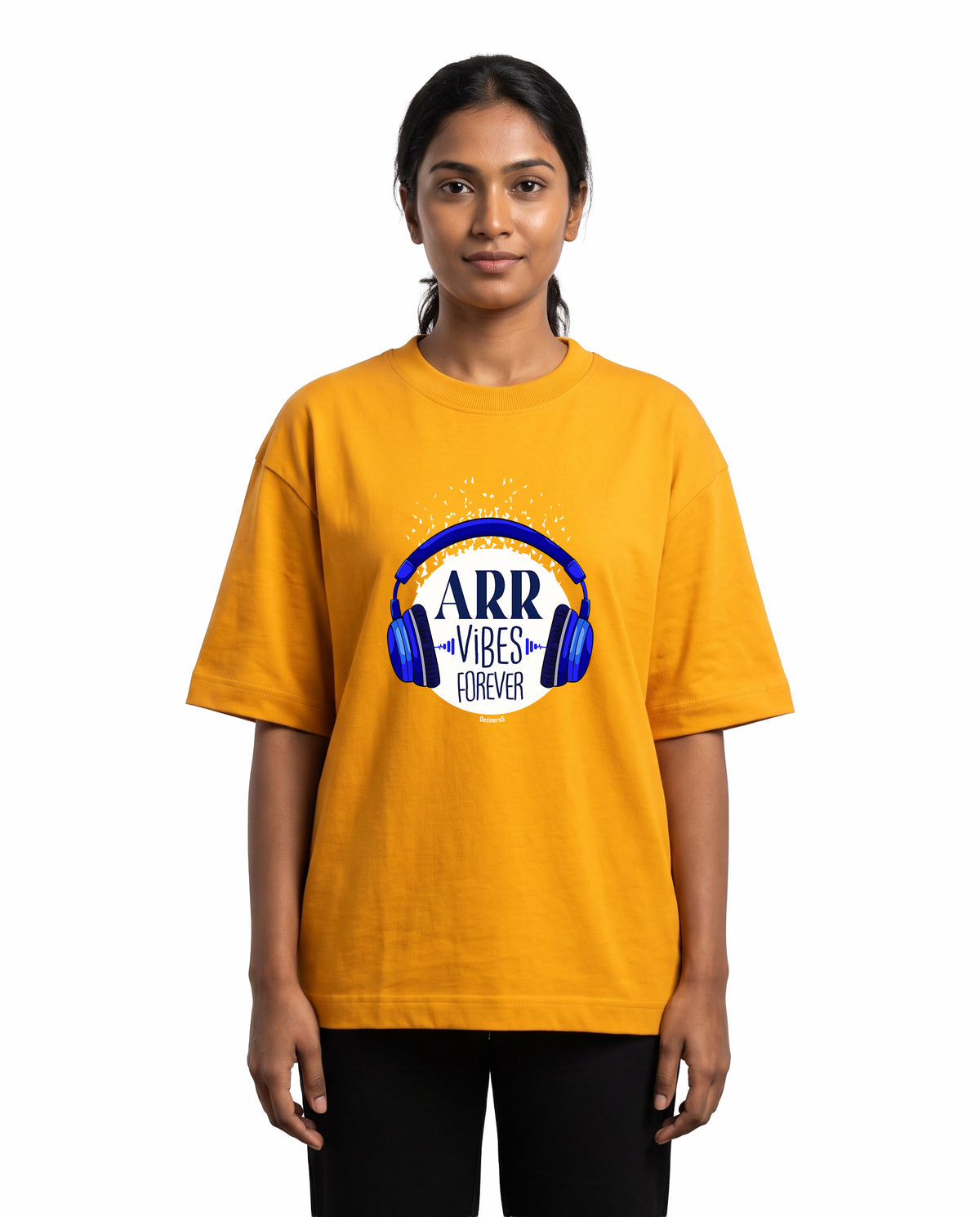 Front view of female model wearing ARR VIBES - Unisex Oversized Graphic T-Shirt in golden yellow in a studio setting.