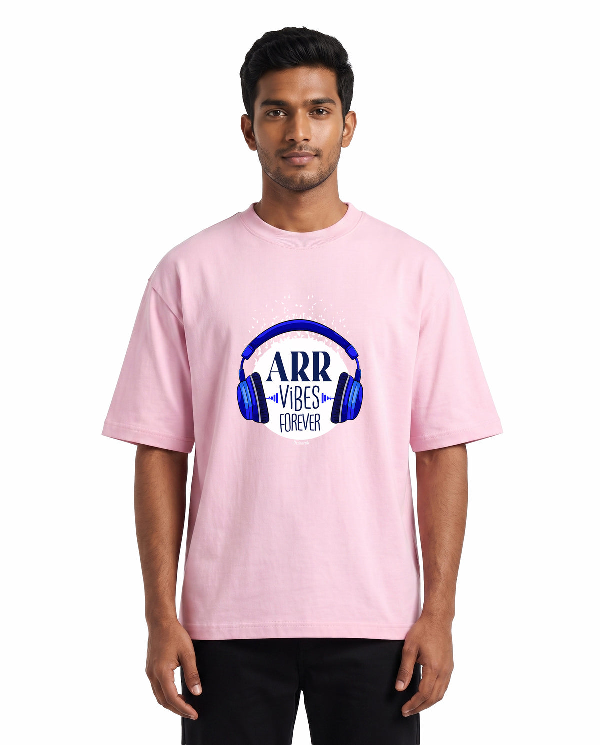 Front view of male model wearing ARR VIBES - Unisex Oversized Graphic T-Shirt in light baby pink in a studio setting.