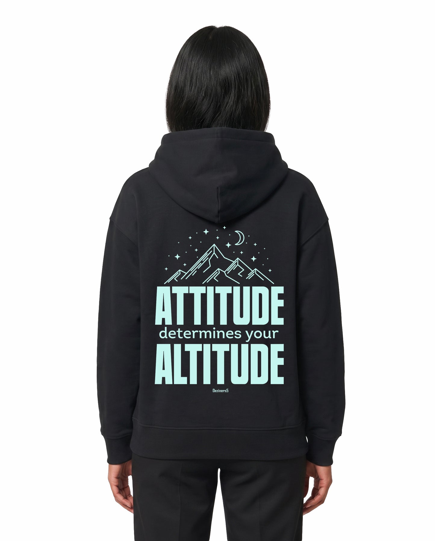 Back view of female model wearing ATTITUDE - Unisex Regular Fit Hoodie in black in a studio setting.