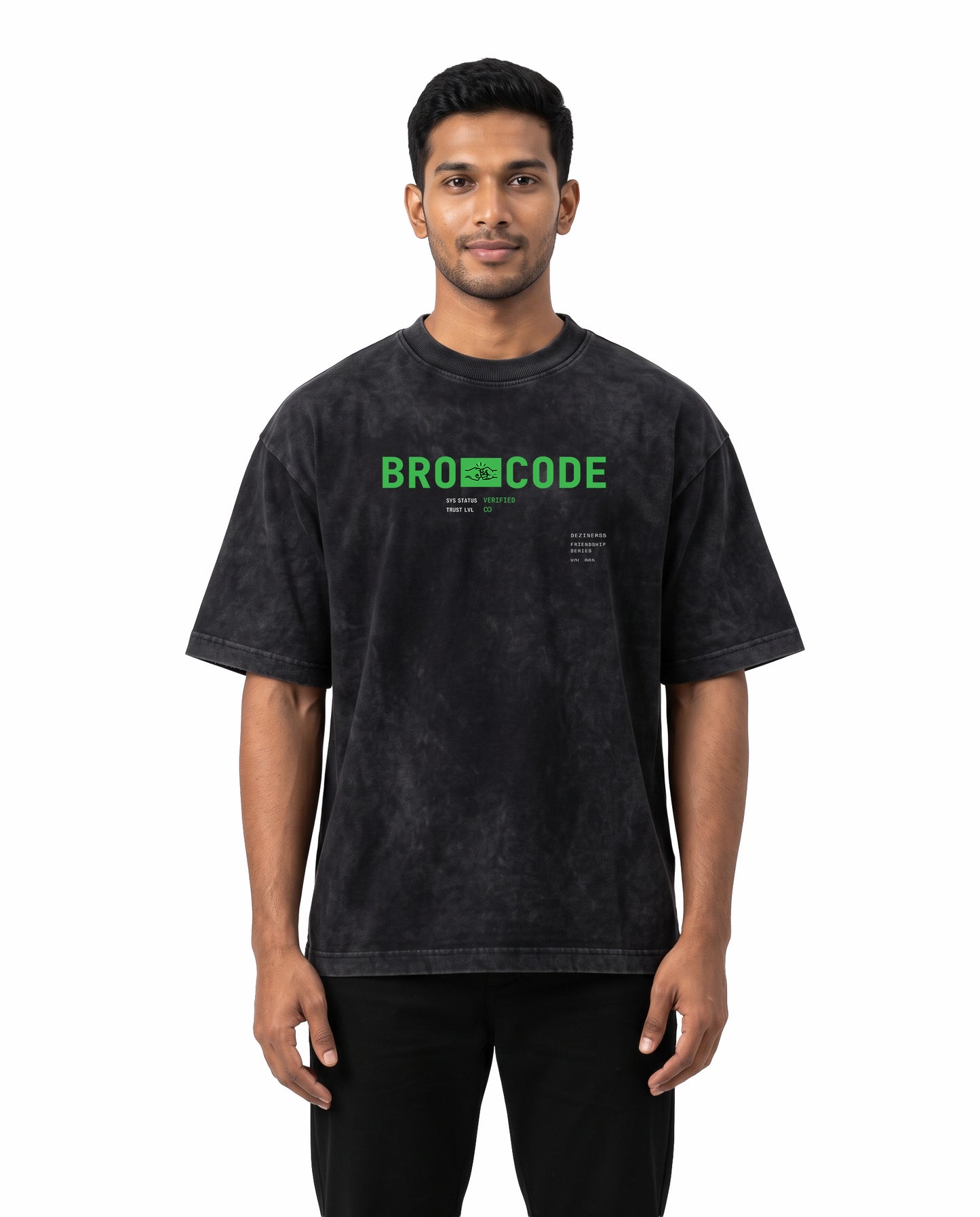 Front view of male model wearing BRO CODE unisex acid washed oversized graphic t-shirt in black in a studio setting.
