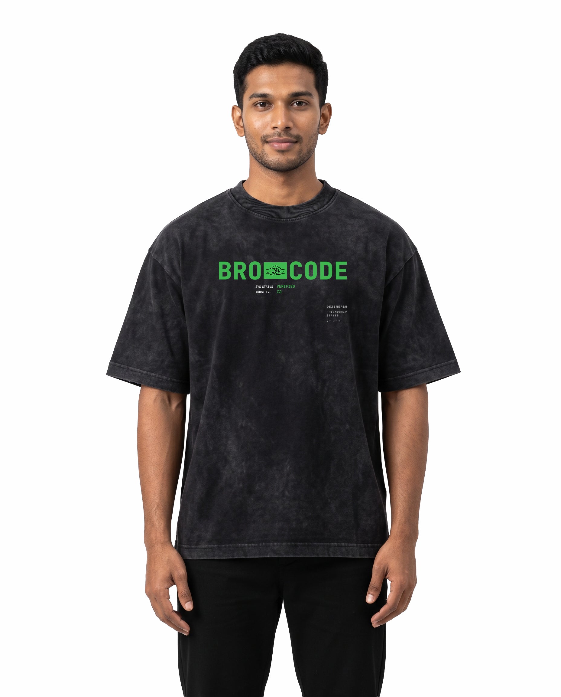Front view of male model wearing BRO CODE unisex acid washed oversized graphic t-shirt in black in a studio setting.