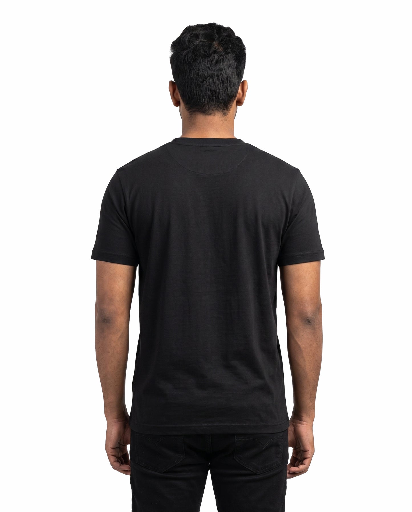 Back view of male model wearing DADDY'S HOME men's regular-fit t-shirt in black in a studio setting.