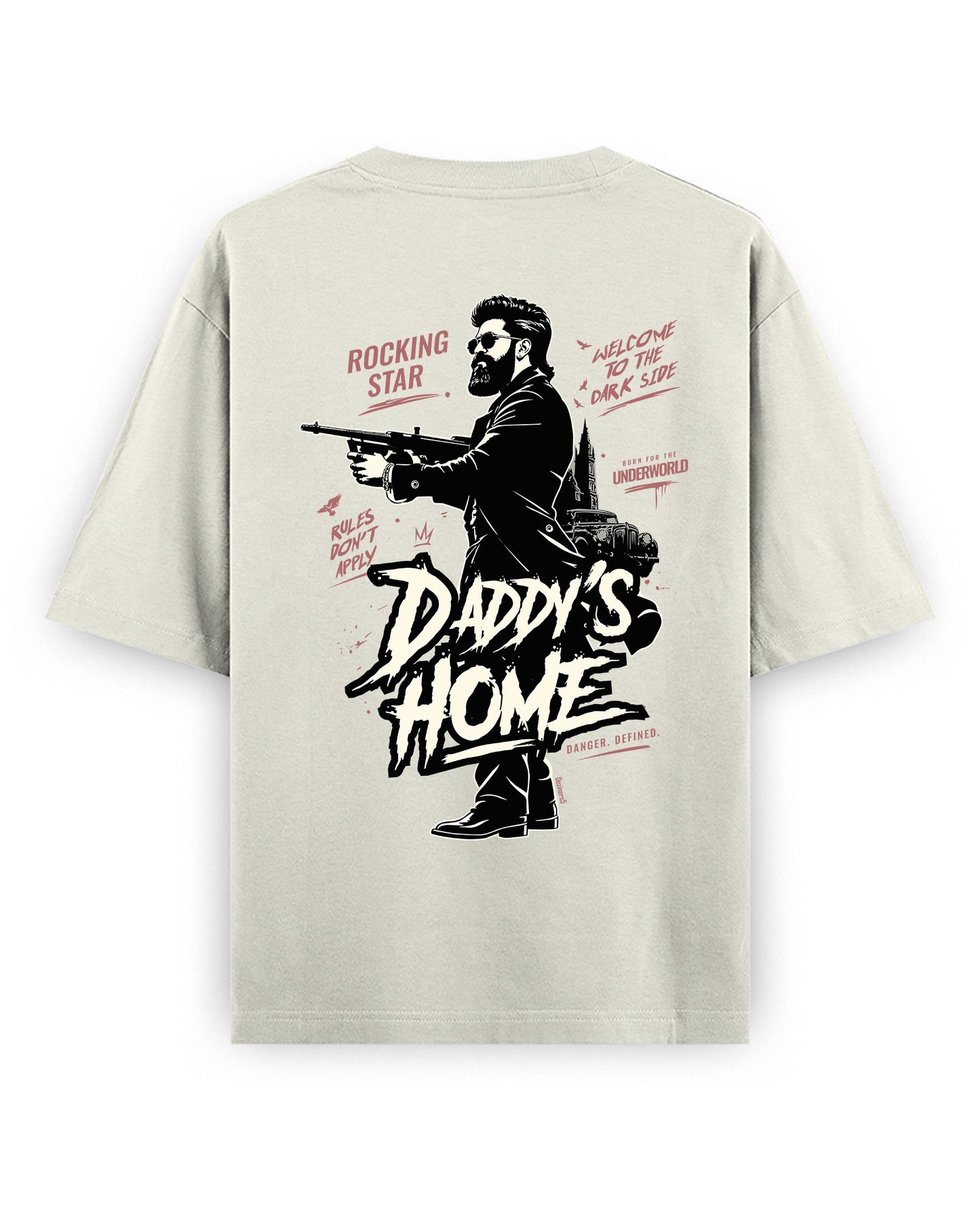 Back view of DADDY'S HOME unisex oversized graphic t-shirt in off-white in a studio setting.