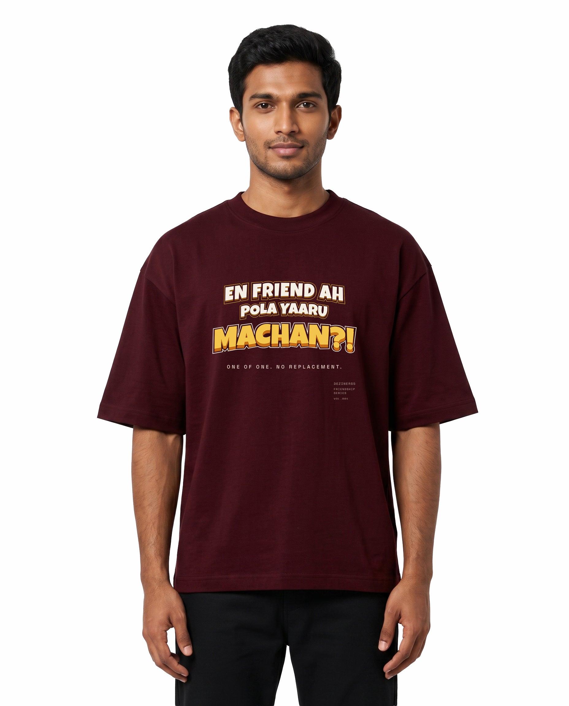Front view of male model wearing EN FRIEND AH POLA YAARU MACHAN unisex oversized graphic t-shirt in maroon in a studio setting.