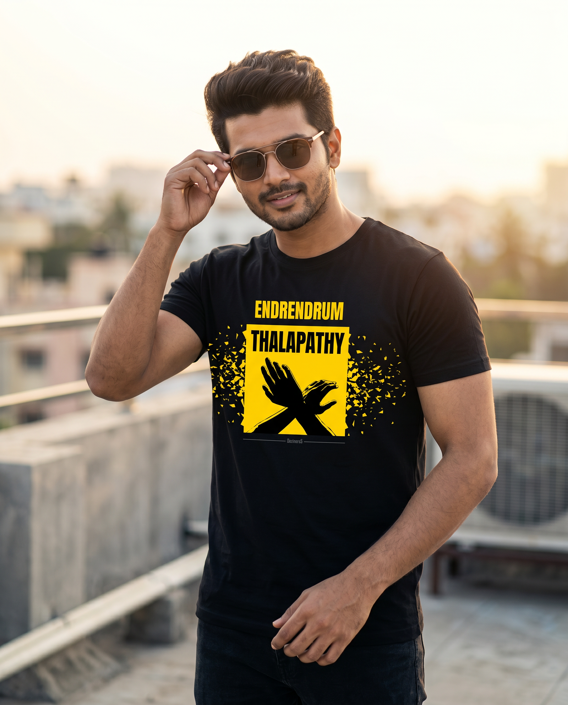 Young South Indian male wearing the ENDRENDRUM THALAPATHY black men's regular-fit t-shirt in a Tamil Nadu-inspired lifestyle setting.