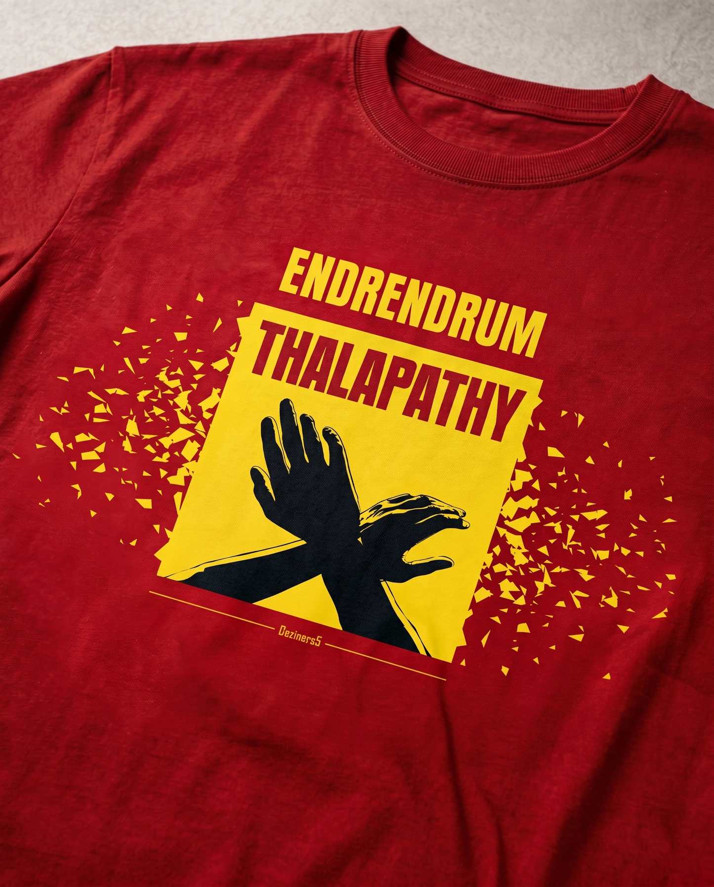 Detailed close-up of the ENDRENDRUM THALAPATHY front graphic print on a red men's regular-fit t-shirt.
