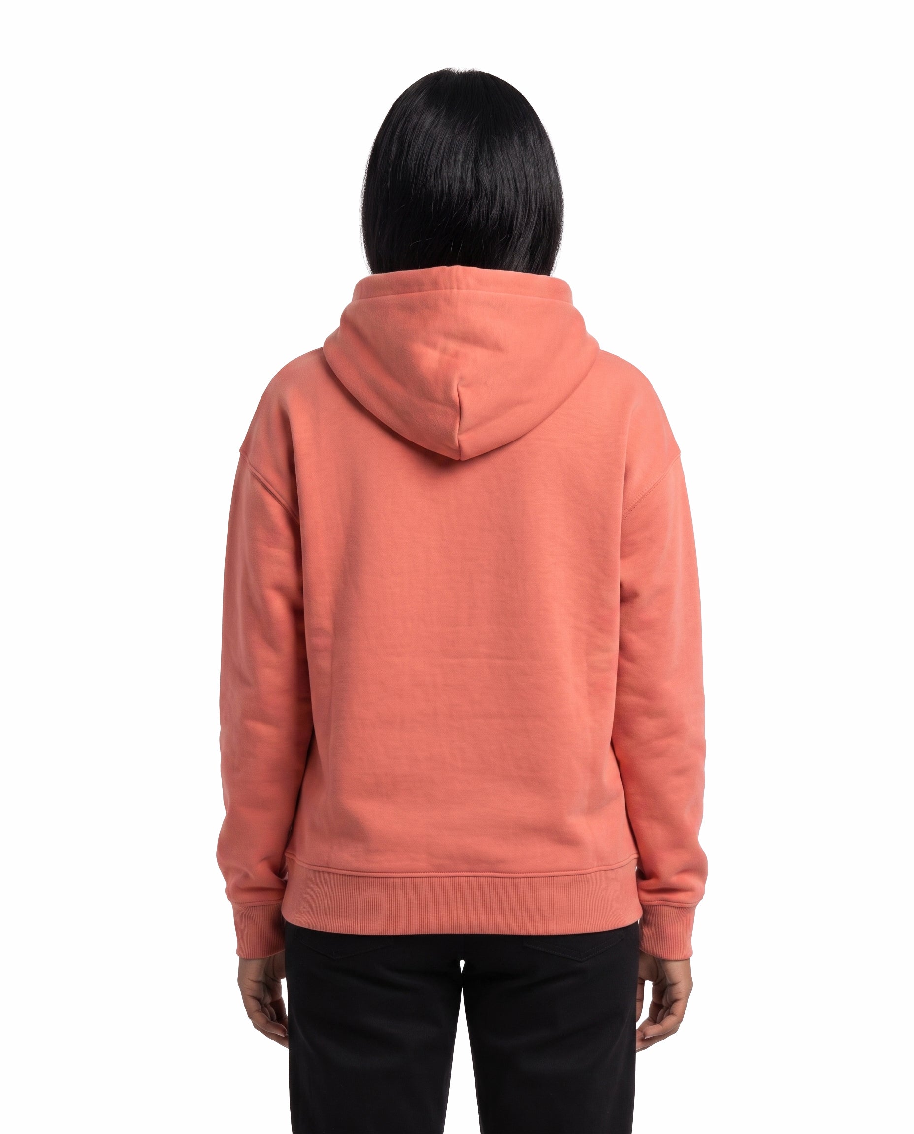 Back view of female model wearing EXPRESS YOURSELF - Unisex Regular Fit Hoodie in coral in a studio setting.