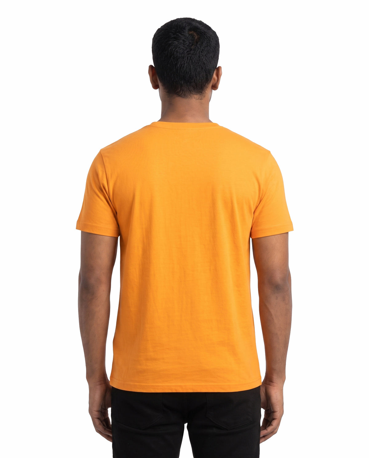 Back view of male model wearing GANESH – Devotional Men's Regular Fit T-Shirt in golden yellow in a studio setting.