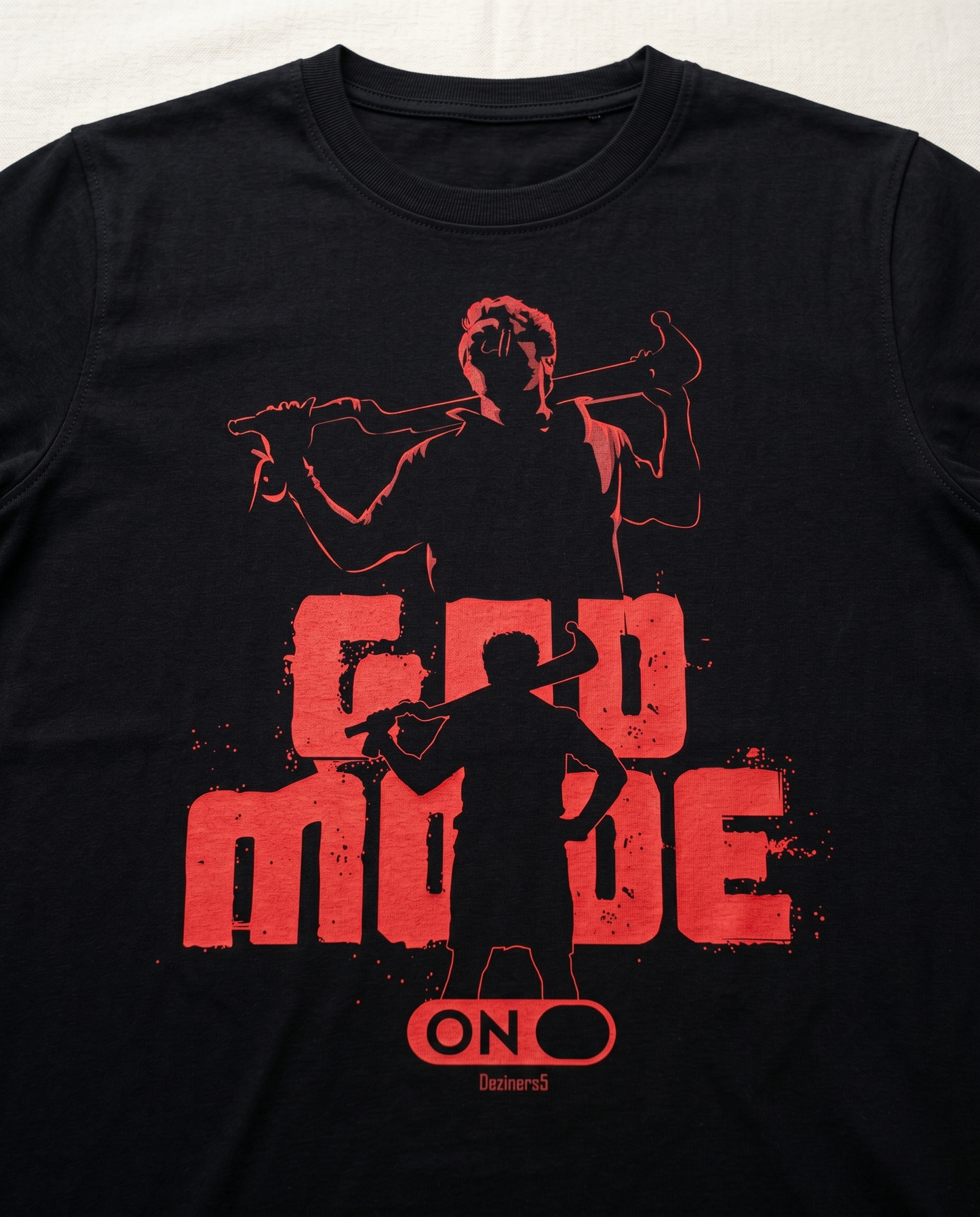 Close-up view of the GOD MODE front graphic print highlighting premium print quality and design details on a black men's regular-fit t-shirt.