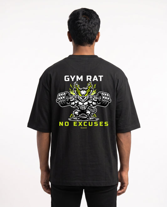 Male model wearing GYM RAT unisex oversized graphic t-shirt in black with Gym Rat No Excuses graphic illustration as a large back print.