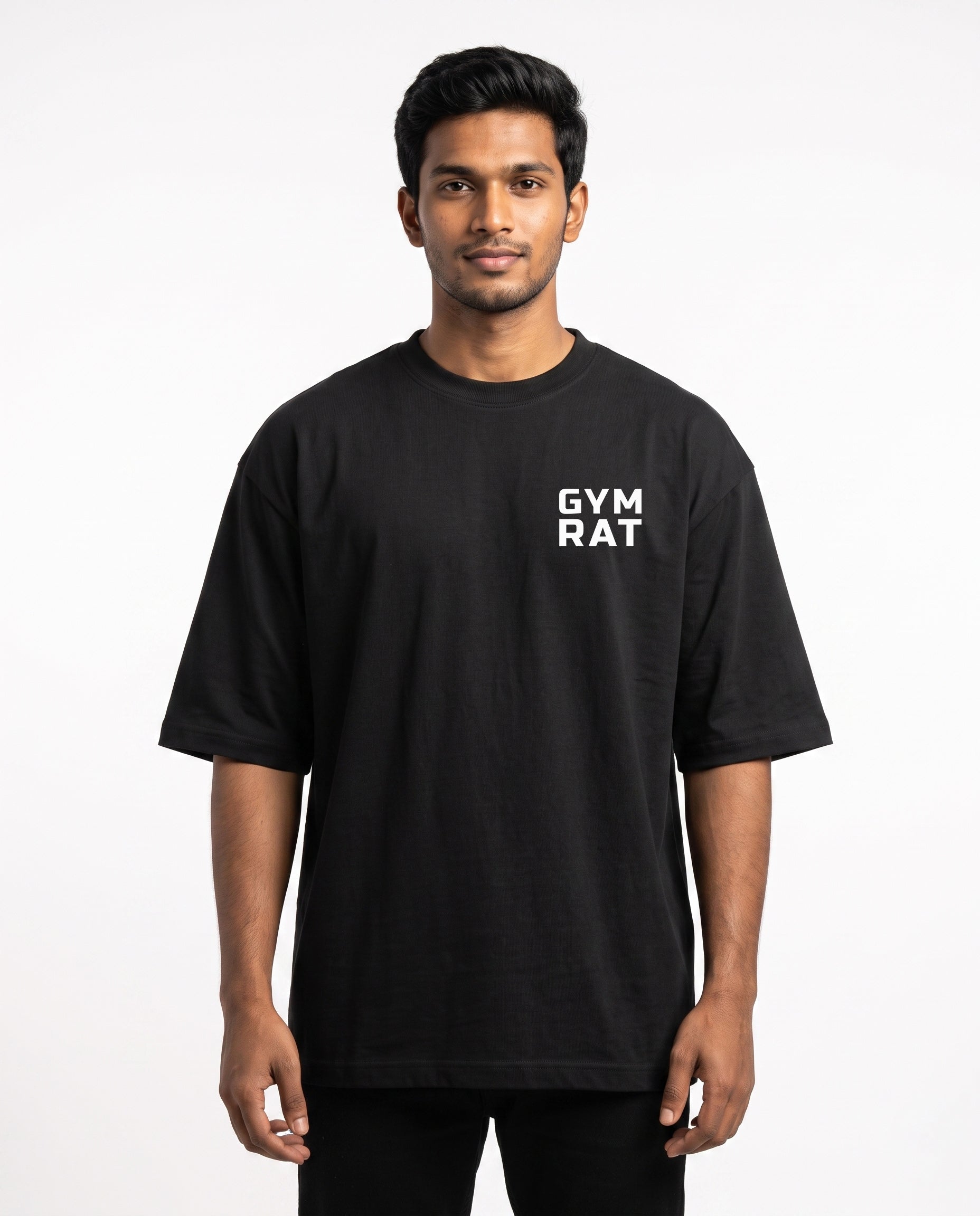 Male model wearing GYM RAT unisex oversized graphic t-shirt in black with Gym Rat logo as a pocket print.