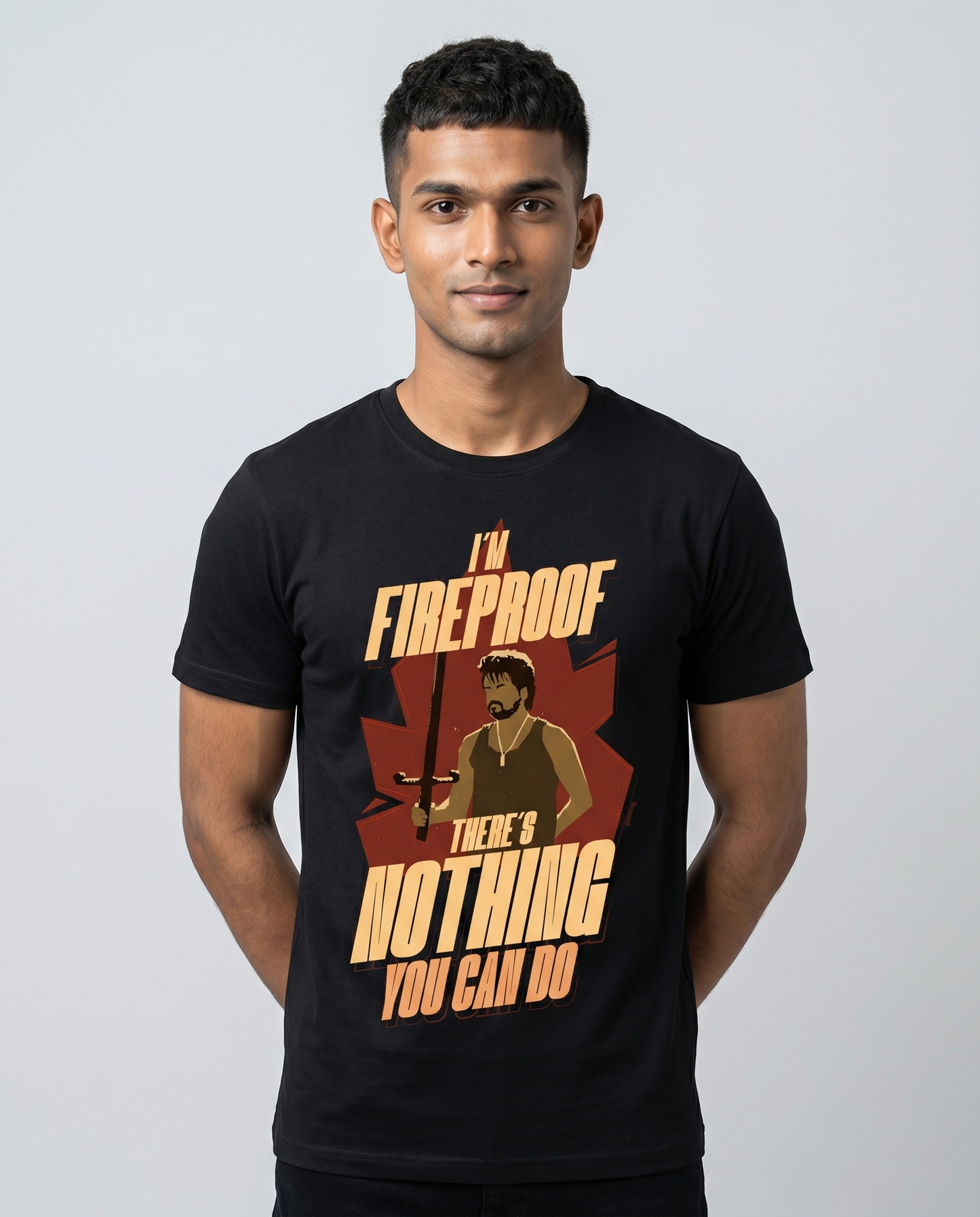 Young South Indian male wearing I'M FIREROOF men's regular-fit t-shirt in black in professional studio portrait.