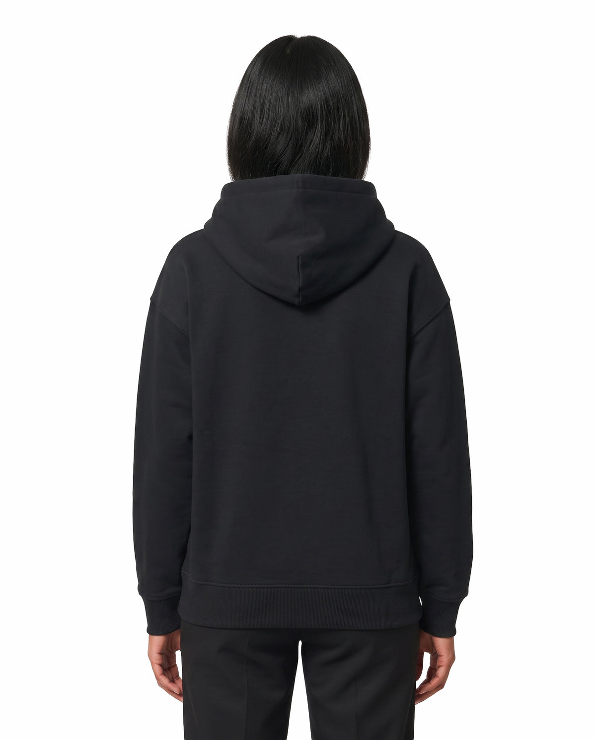 Back view of female model wearing ISAIPUYAL - Unisex Regular Fit Hoodie in black in a studio setting.