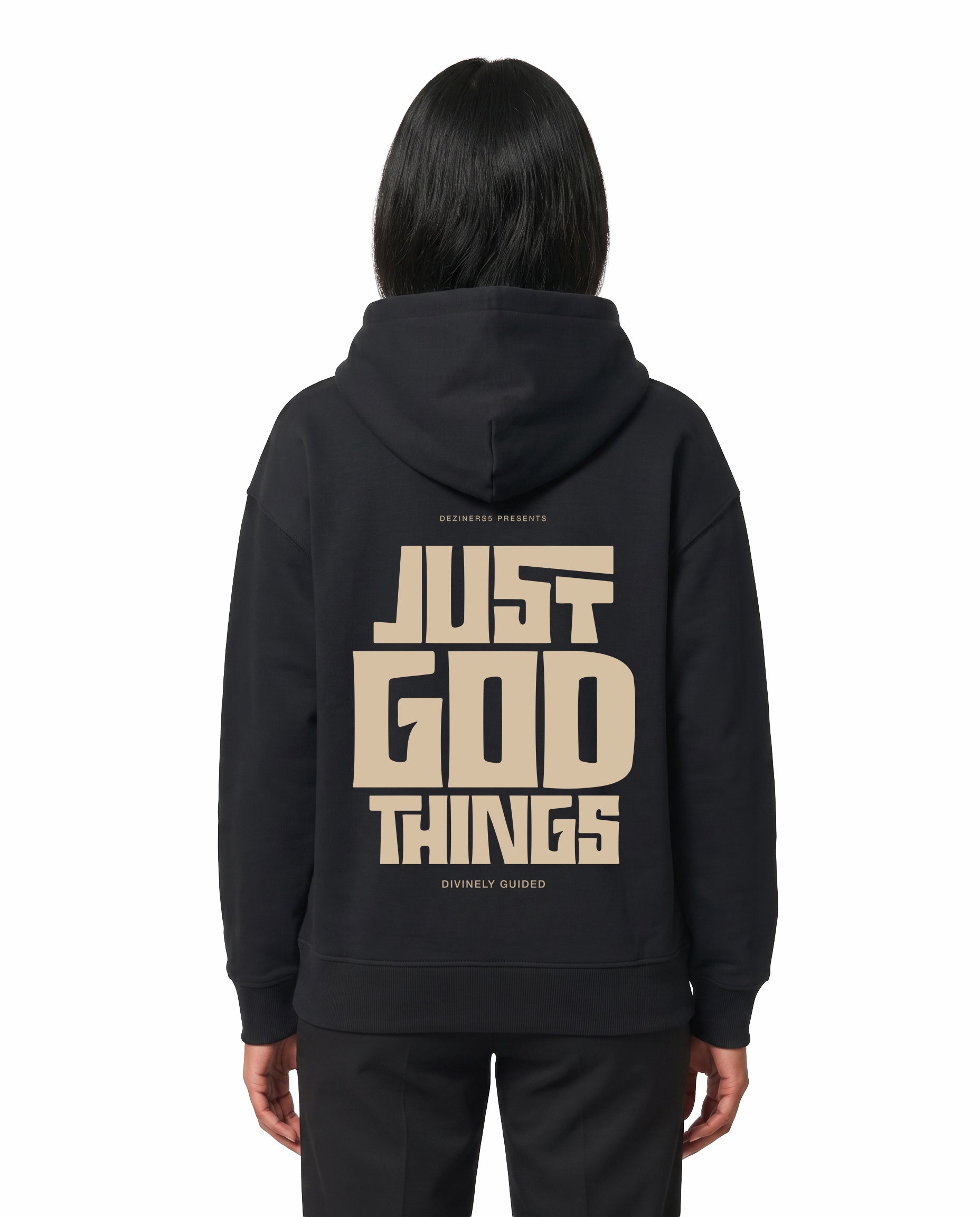 Back view of female model wearing JUST GOD THINGS - Unisex Regular Fit Hoodie in black in a studio setting.