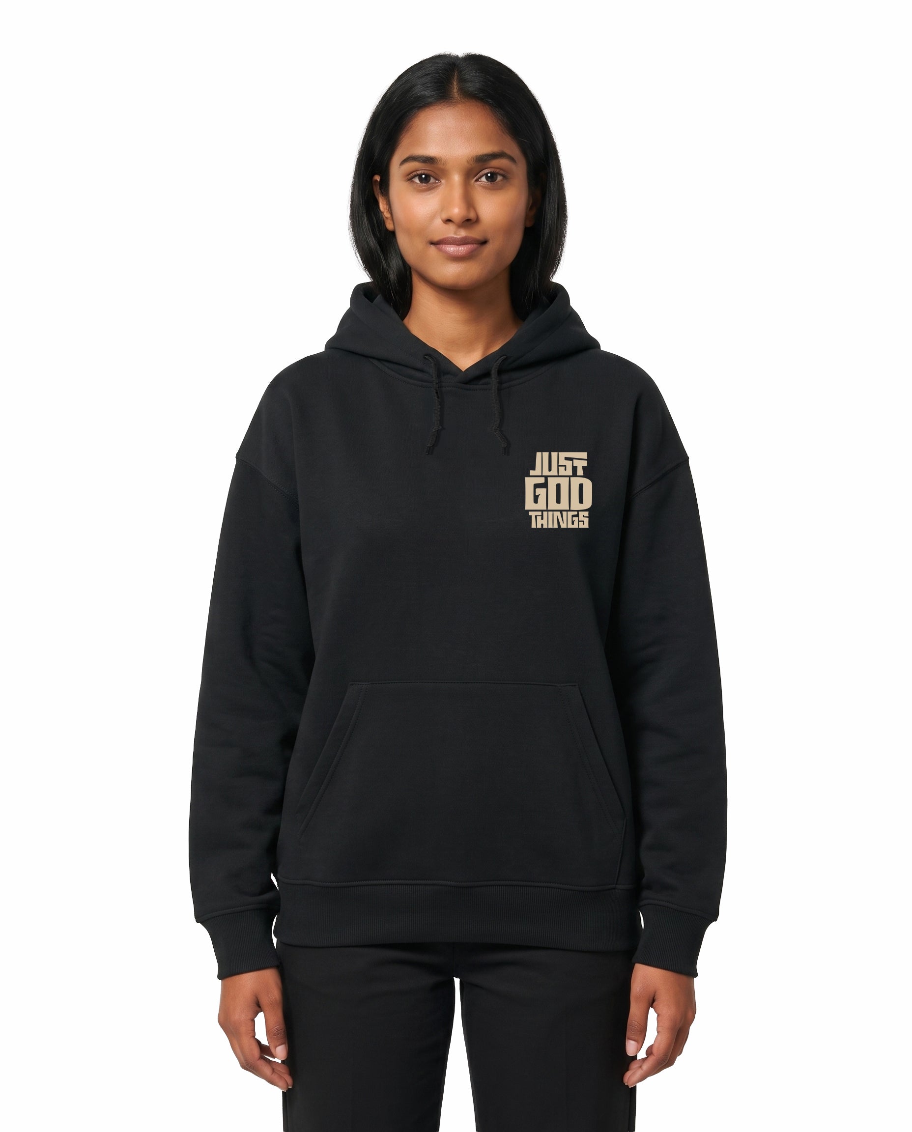 Front view of female model wearing JUST GOD THINGS - Unisex Regular Fit Hoodie in black in a studio setting.