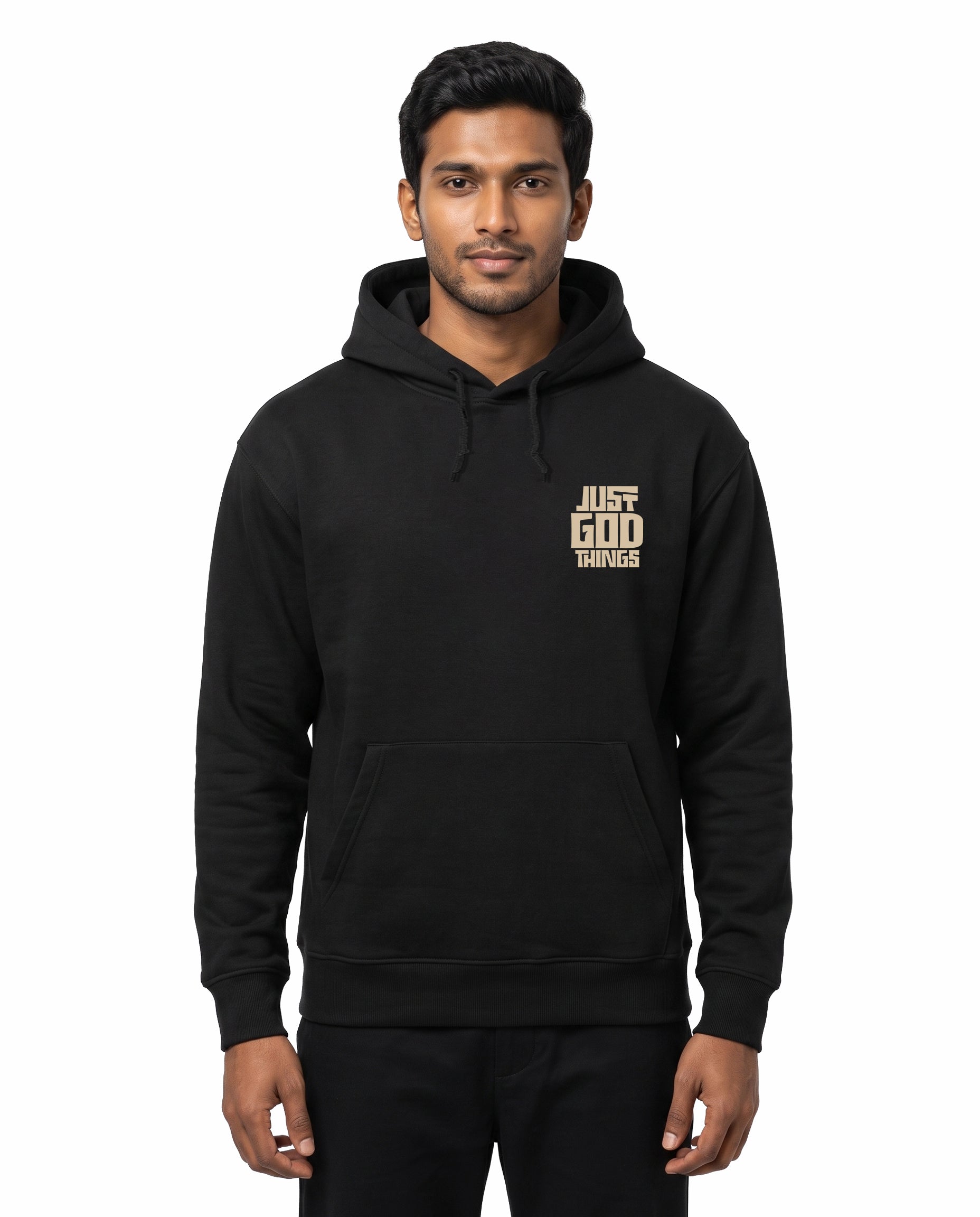 Front view of male model wearing JUST GOD THINGS - Unisex Regular Fit Hoodie in black in a studio setting.