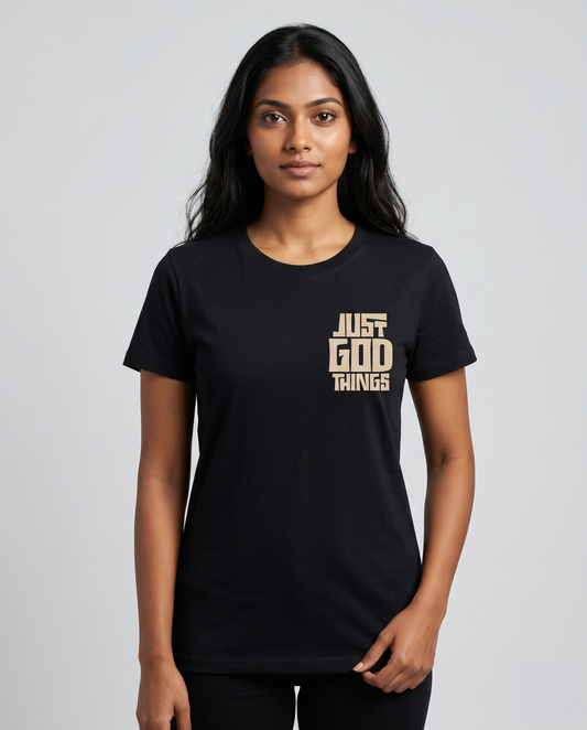 Young South Indian female model wearing JUST GOD THINGS women's regular fit black graphic t-shirt with chest print.