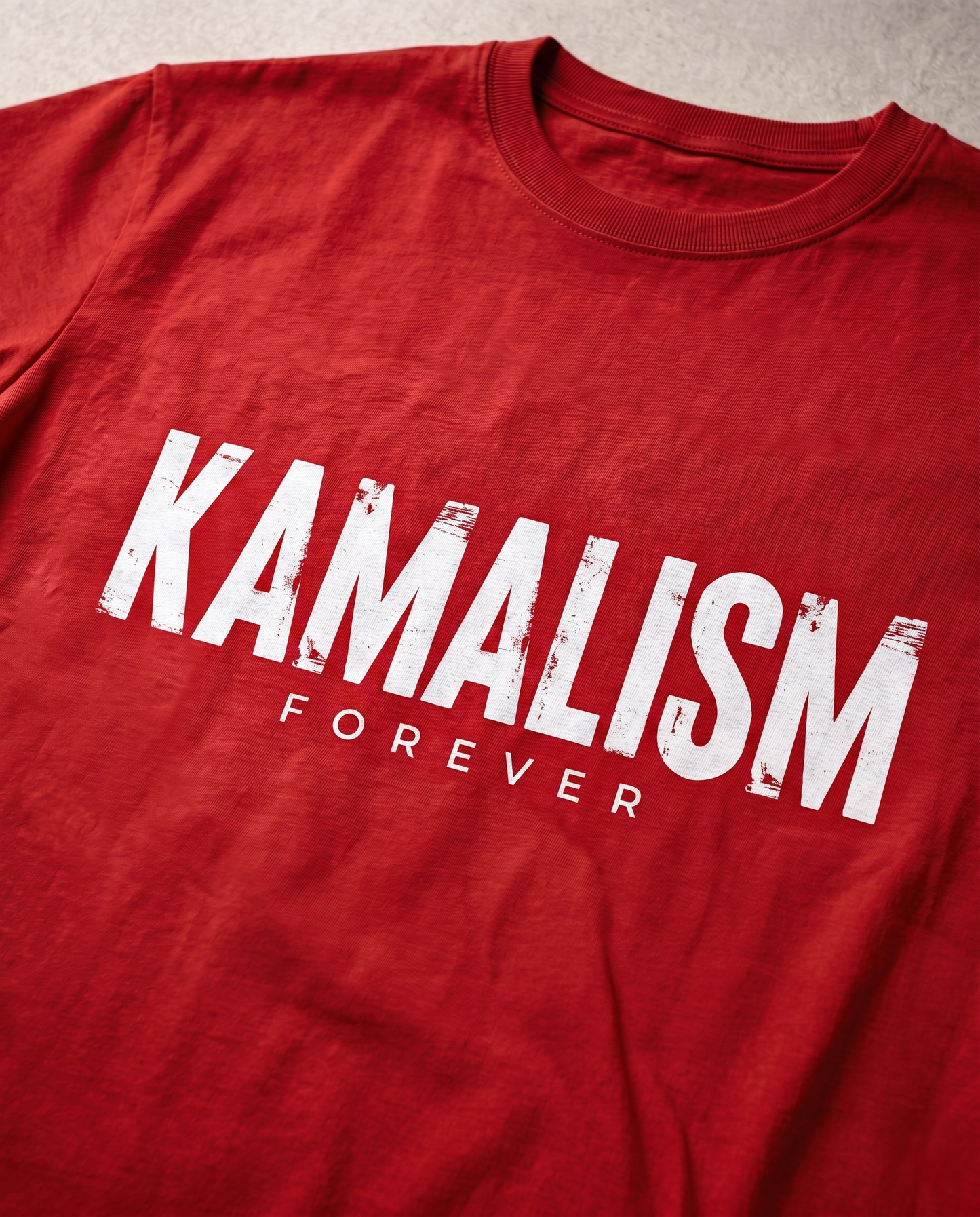 Close-up view of the KAMALISM FOREVER front graphic print showcasing premium print quality and design details on a red men's regular-fit t-shirt.