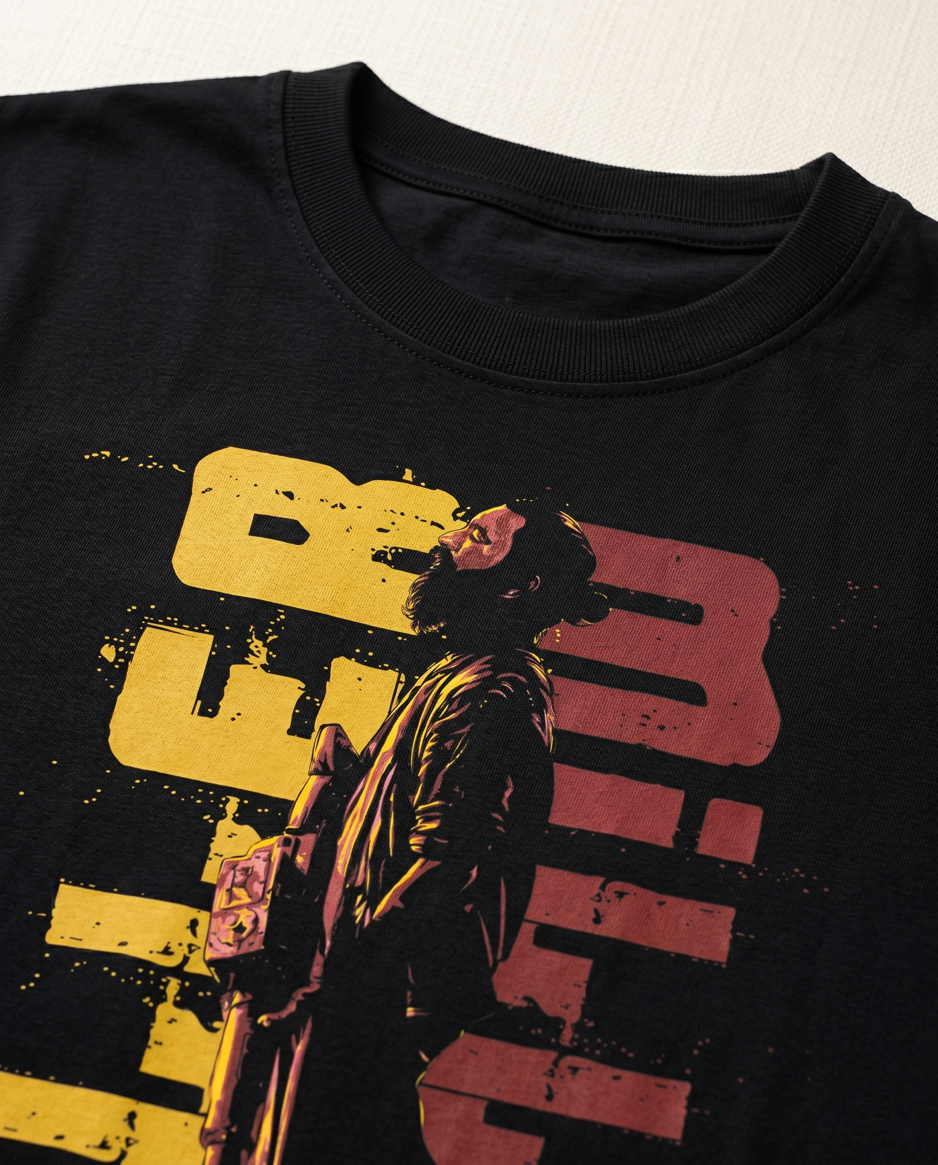 Detailed close-up of the KILLER MILLER graphic print showcasing premium print quality and illustration details on a black men's regular-fit t-shirt.
