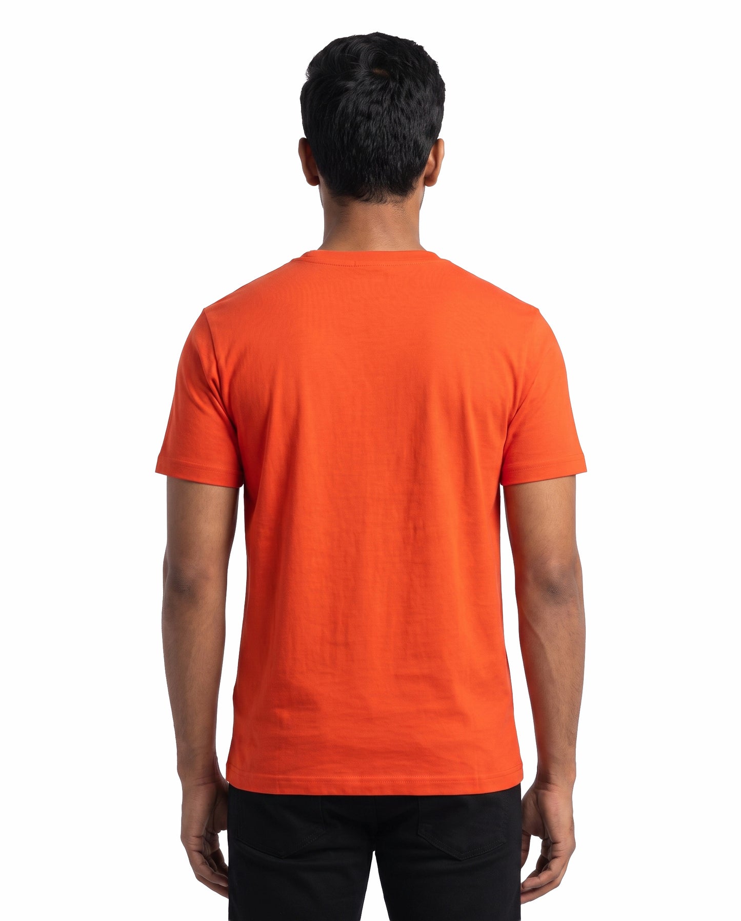 Back view of male model wearing LOCHAK MOCHAK BOCHAK men's regular-fit t-shirt in orange featuring a Vadivelu-inspired comedy meme design in a studio setting.