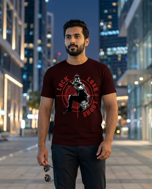 Young South Indian male wearing the LOCK LOAD SHOOT men's regular-fit t-shirt in maroon in a premium modern professional environment.