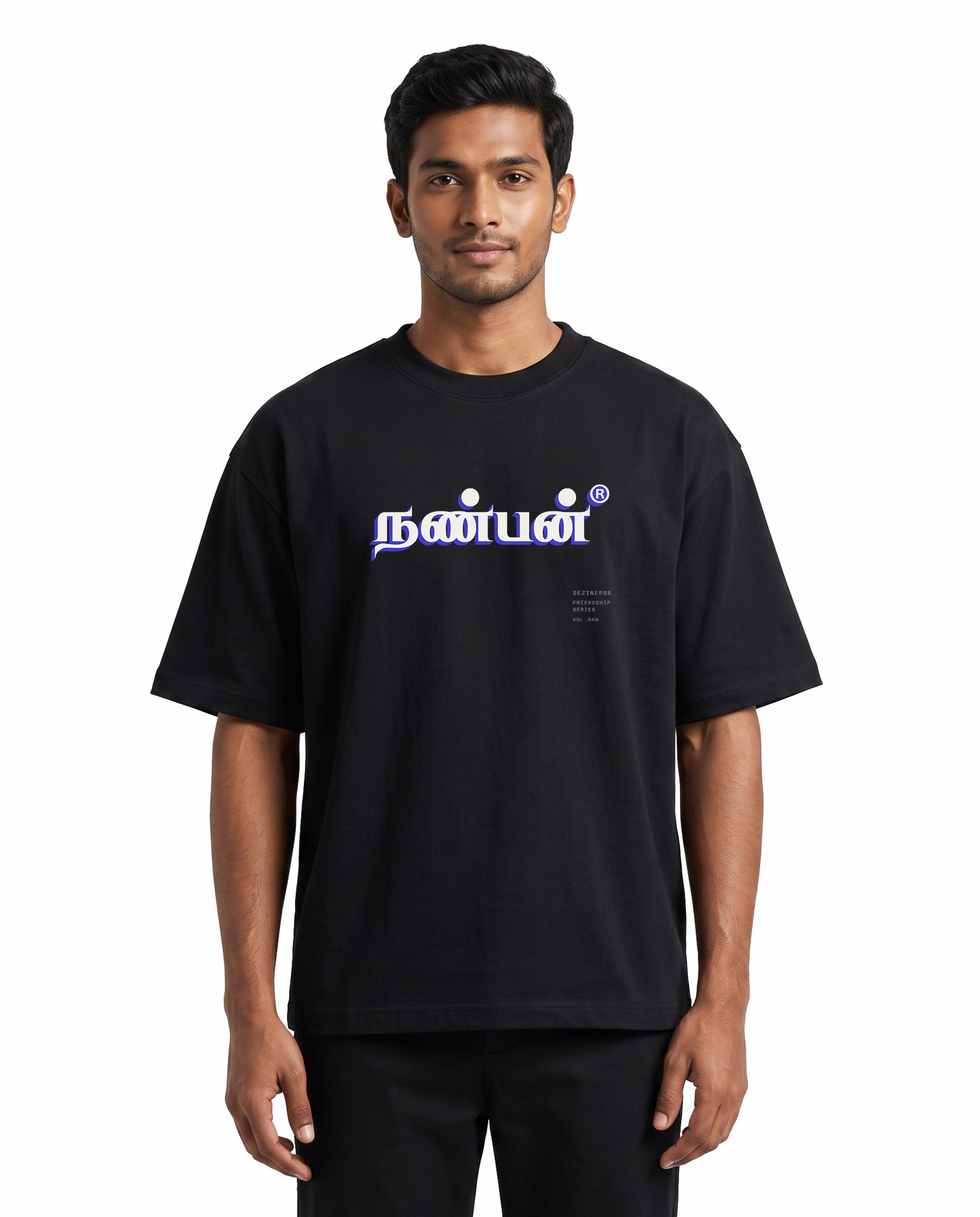 Front view of male model wearing NANBAN oversized graphic t-shirt in black in a studio setting.