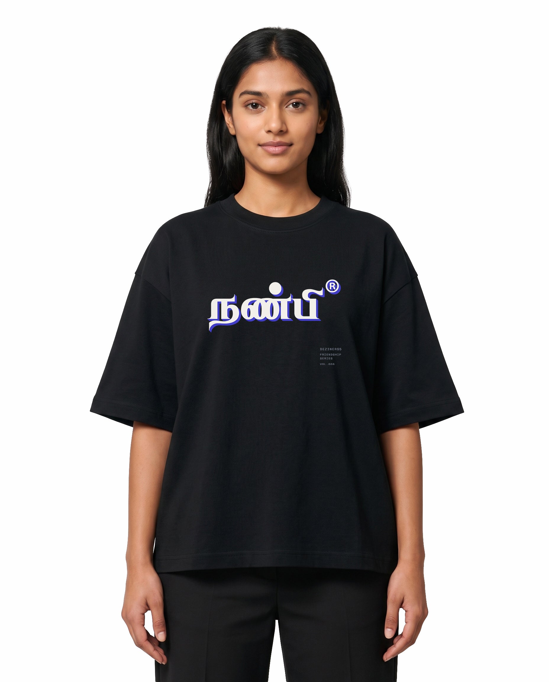 Front view of female model wearing NANBI oversized graphic t-shirt in black in a studio setting.