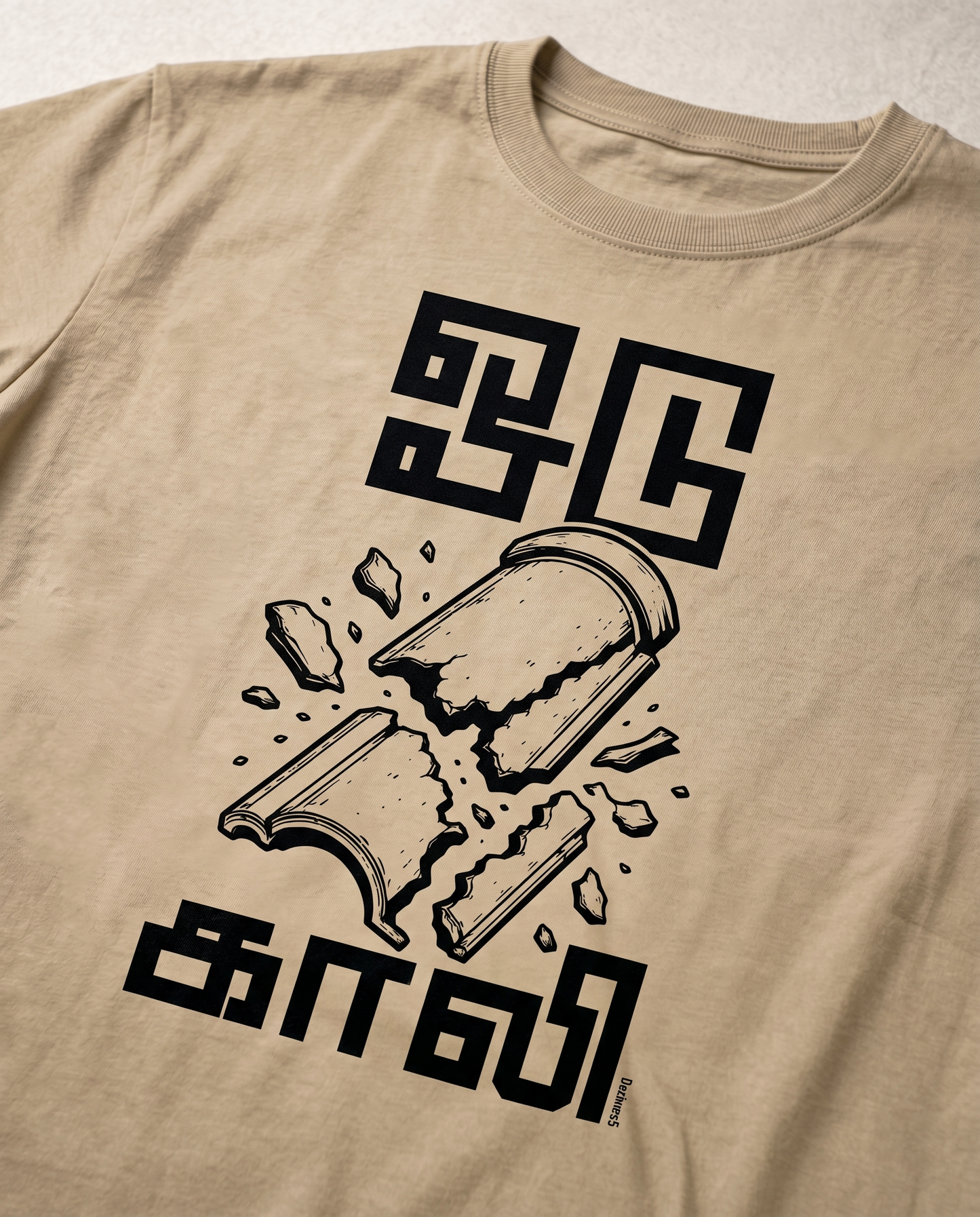 Detailed close-up of the ODUGAALI Tamil typography graphic print showcasing premium print quality, vibrant artwork, and crisp design details on a beige men's regular-fit t-shirt.
