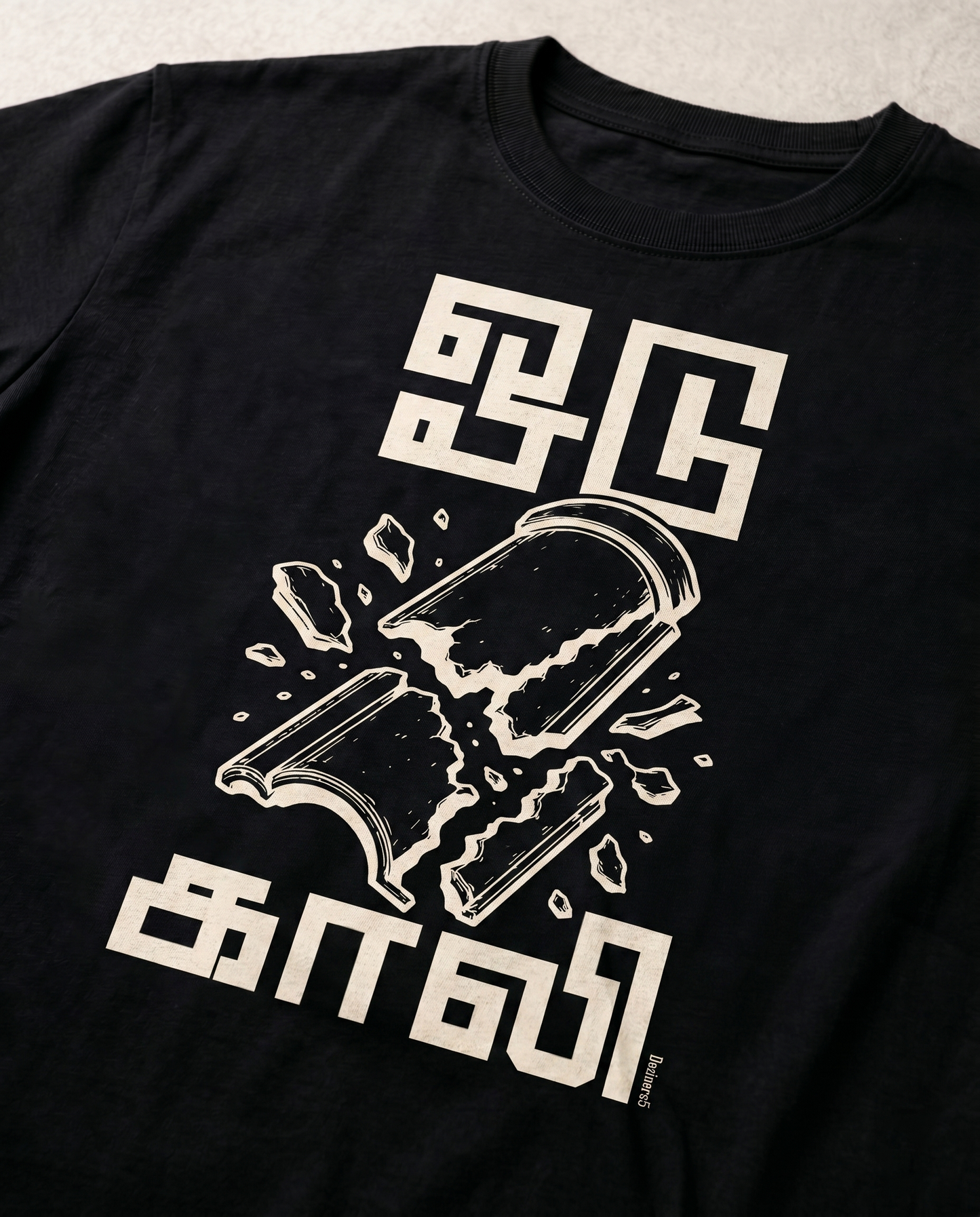 Detailed close-up of the ODUGAALI Tamil typography graphic print showcasing premium print quality, vibrant artwork, and crisp design details on a black men's regular-fit t-shirt.