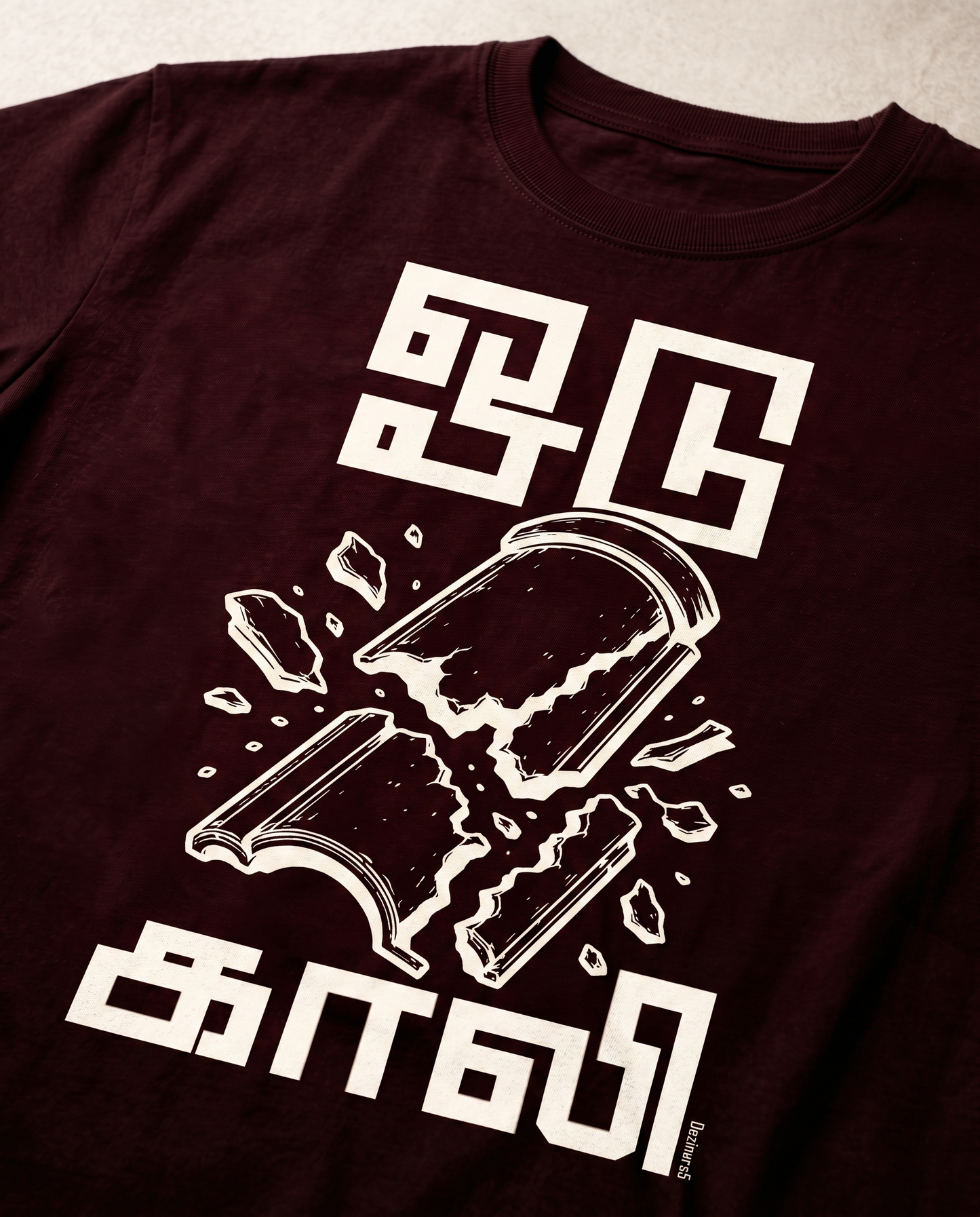 Detailed close-up of the ODUGAALI Tamil typography graphic print showcasing premium print quality, vibrant artwork, and crisp design details on a maroon men's regular-fit t-shirt.
