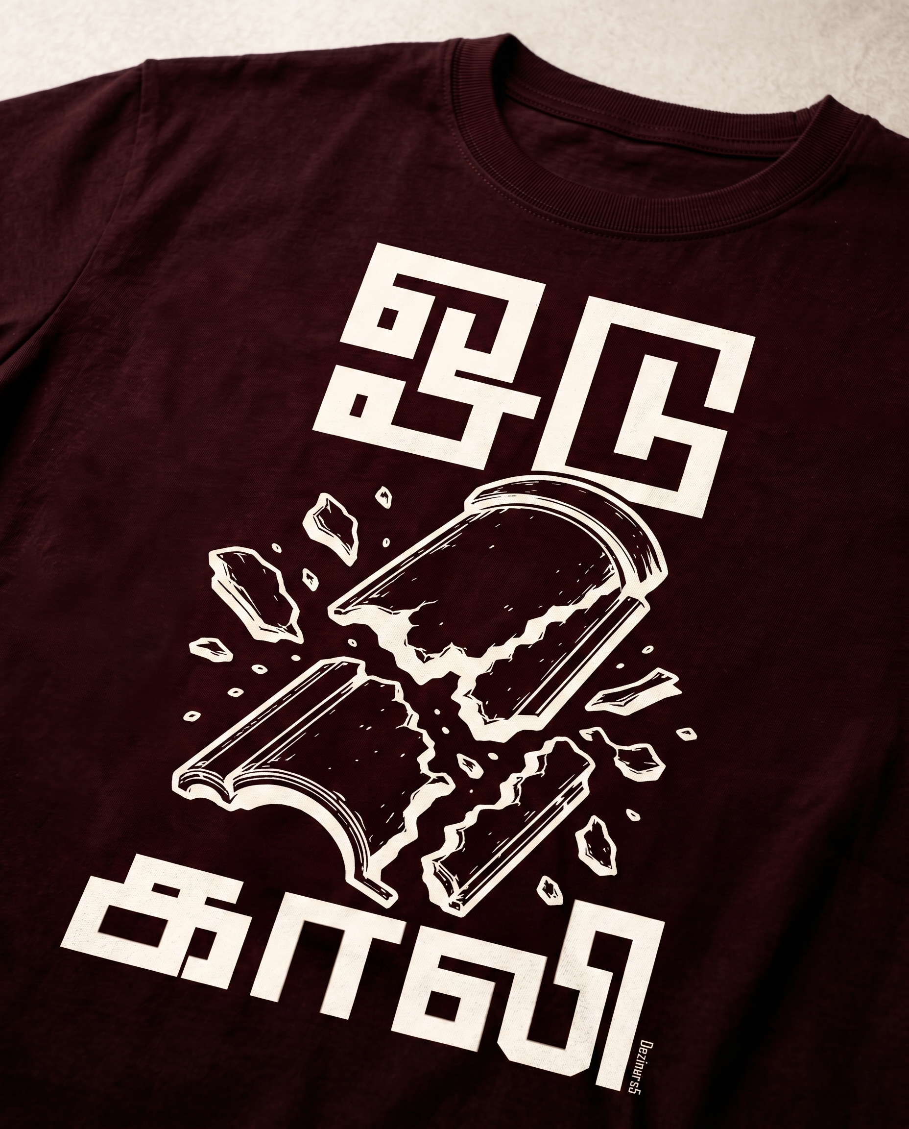 Detailed close-up of the ODUGAALI Tamil typography graphic print showcasing premium print quality, vibrant artwork, and crisp design details on a maroon men's regular-fit t-shirt.
