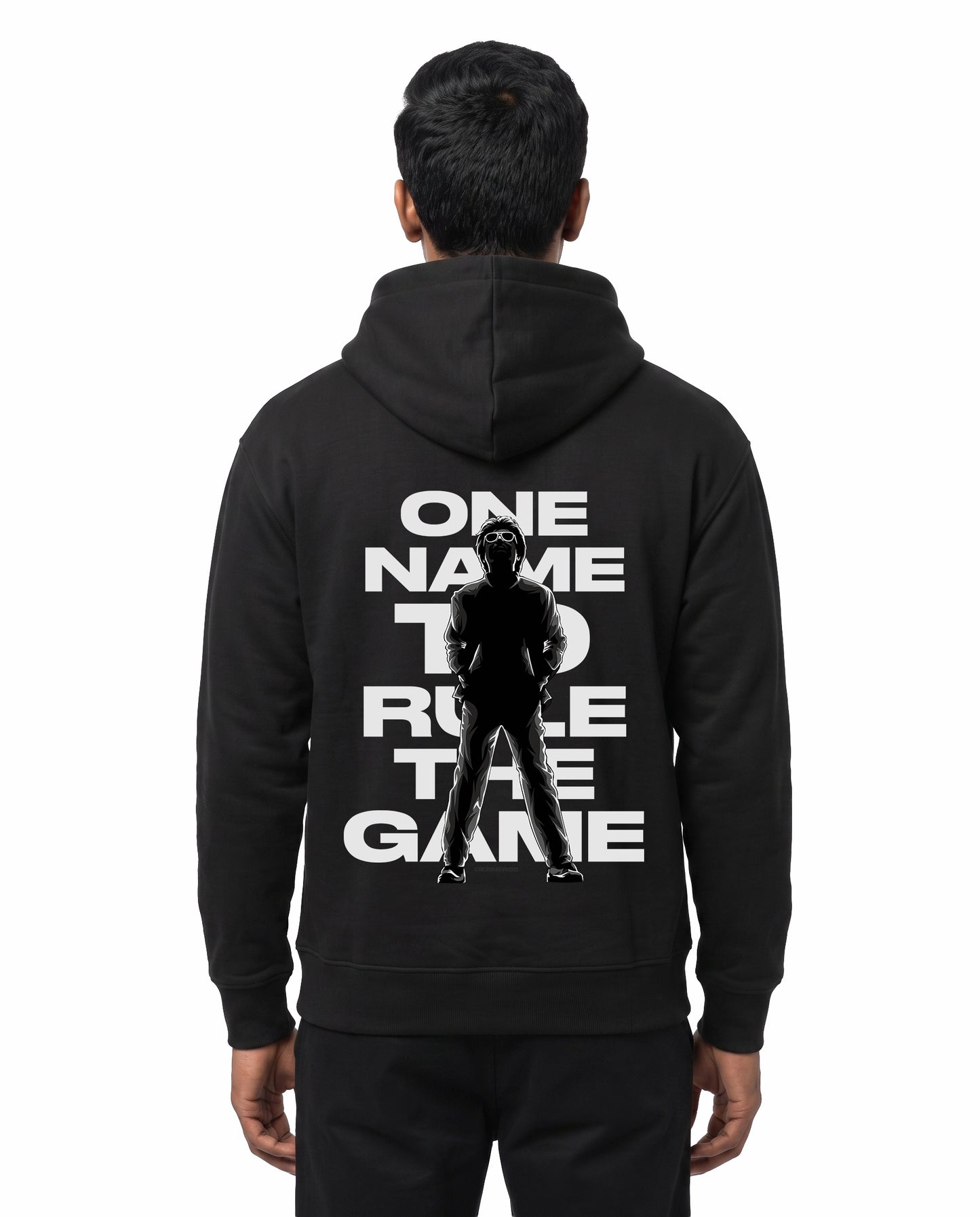 Back view of male model wearing ONE NAME unisex regular-fit hoodie in black in a studio setting.