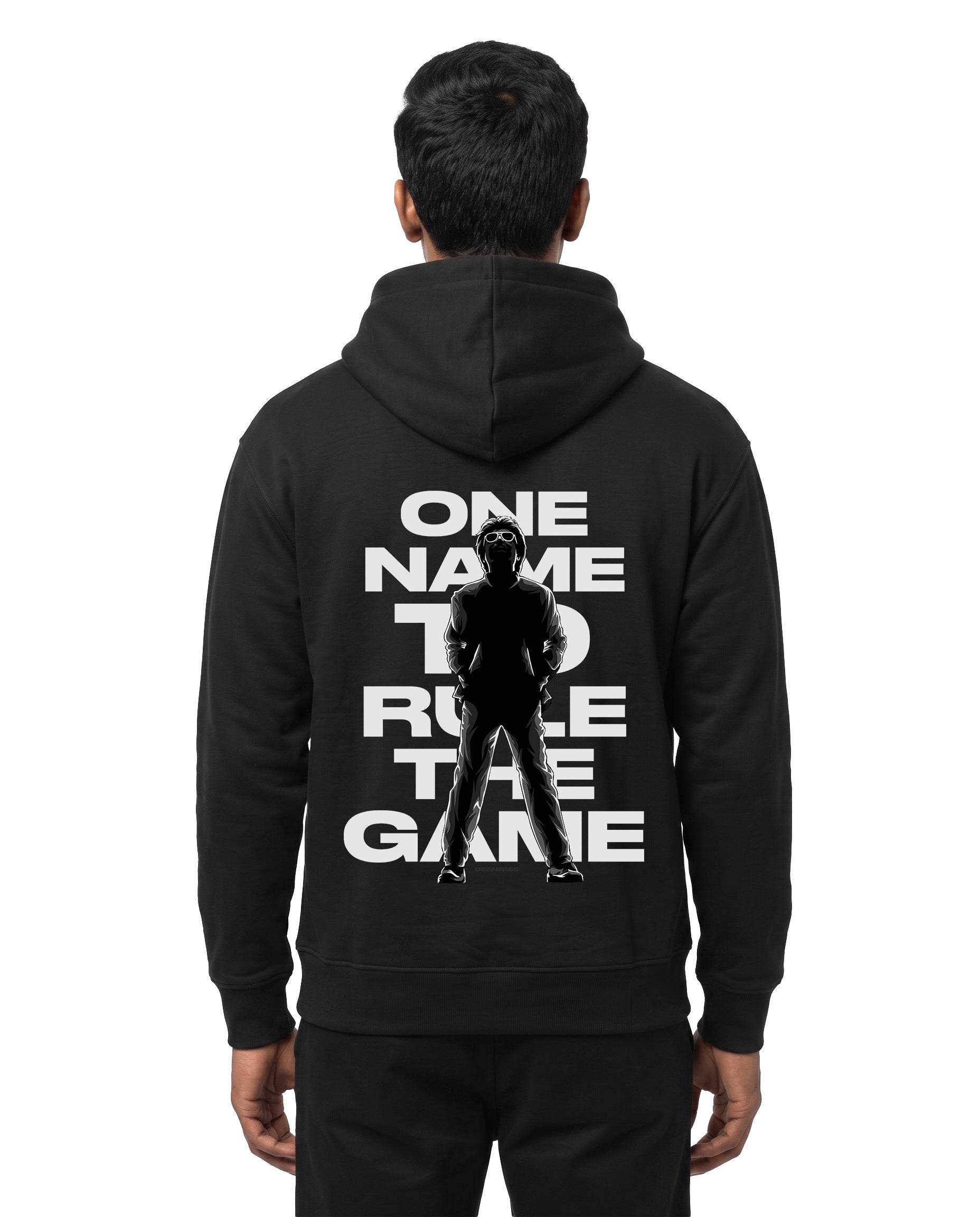 Back view of male model wearing ONE NAME unisex regular-fit hoodie in black in a studio setting.
