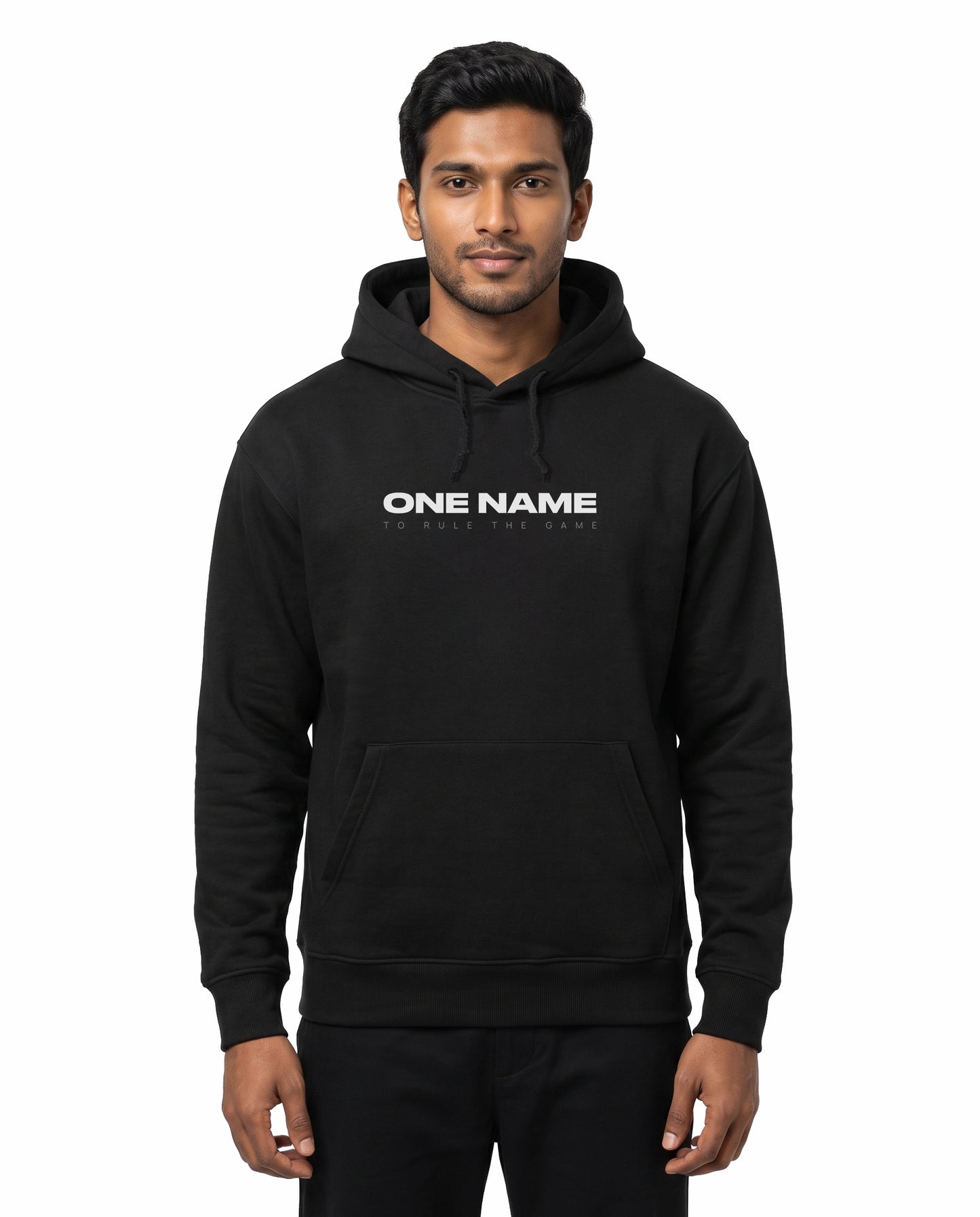 Front view of male model wearing ONE NAME unisex regular-fit hoodie in black in a studio setting.