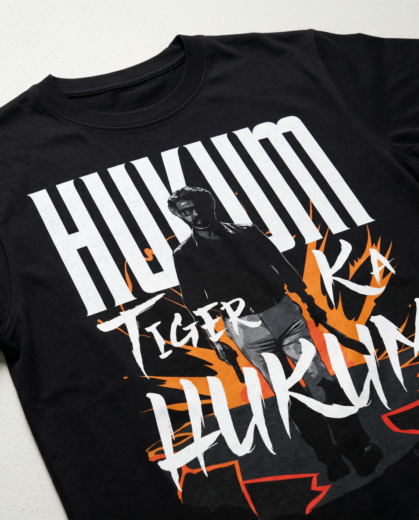 Close-up print detail of ORDER OF THE TIGER artwork on a black men's regular fit graphic t-shirt.