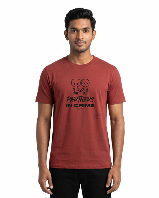 Male model wearing PARTNERS IN CRIME men's regular-fit t-shirt in coral in a studio setting.