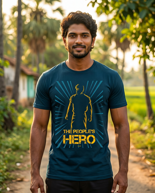 Young South Indian male wearing the PEOPLE'S HERO navy blue men's regular-fit t-shirt in a rural Tamil Nadu lifestyle setting.