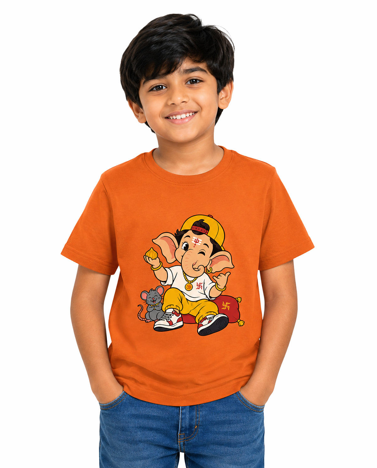 Front view of boy wearing PLAYFUL GANESHA - Boys Regular Fit T-Shirt in orange in a studio setting.