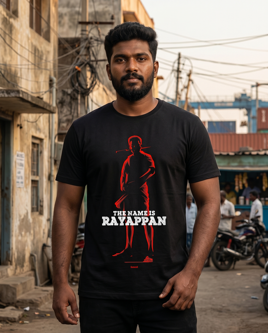 Young South Indian male wearing the RAYAPPAN TRIBUTE black men's regular-fit t-shirt in an authentic North Chennai lifestyle setting.