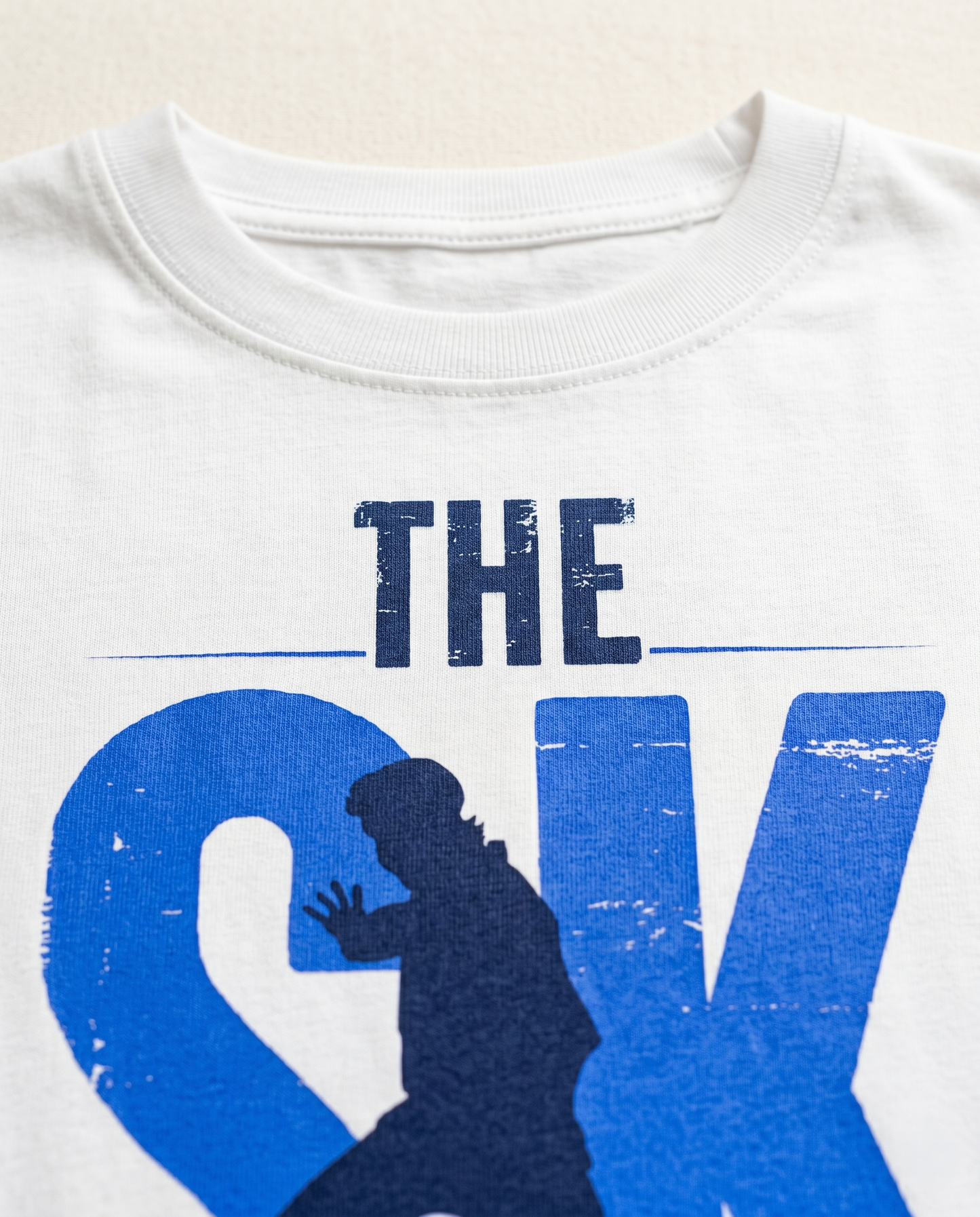 Detailed close-up of the SK FAN graphic print showcasing premium print quality and minimalist design elements on a white men's regular-fit t-shirt.