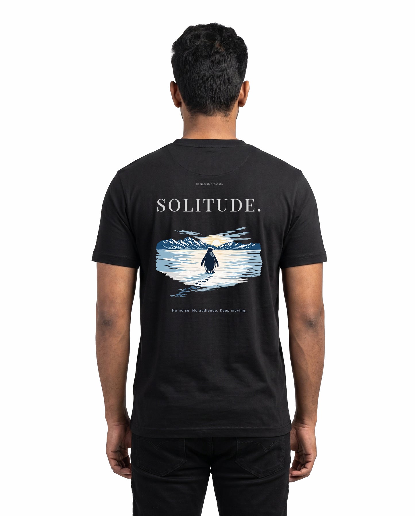 Back view of male model wearing SOLITUDE men's regular-fit t-shirt in black in a studio setting.