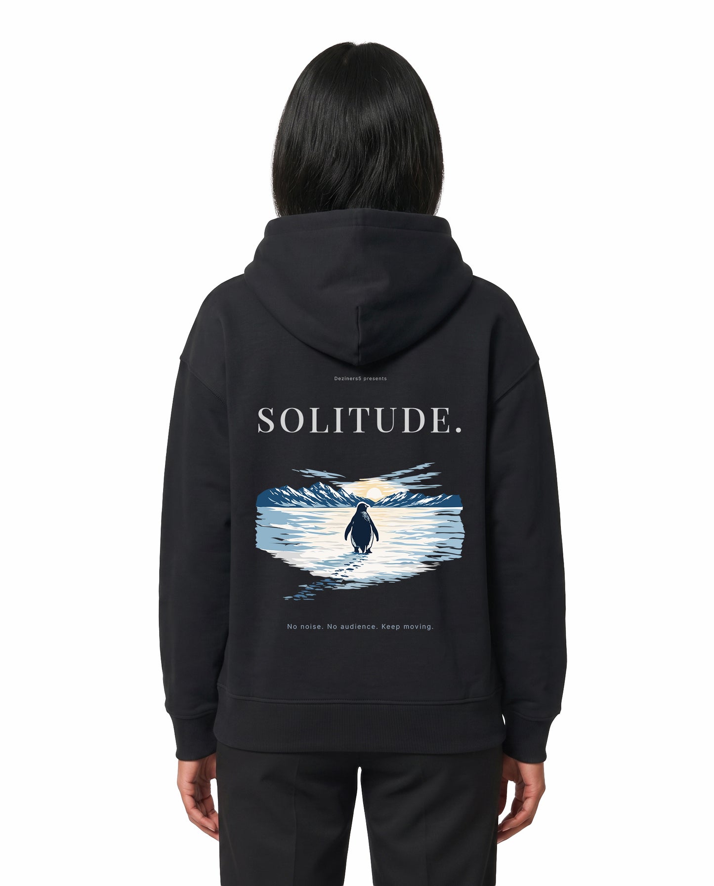 Back view of female model wearing SOLITUDE - unisex regular-fit hoodie in black in a studio setting.